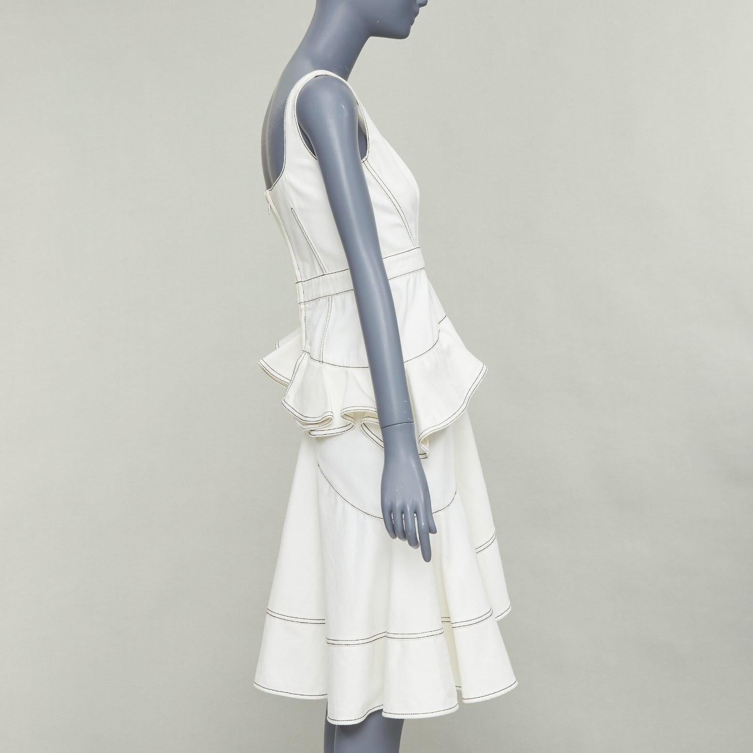 Alexander McQueen 2019 abito midi in denim nero con impunture, volant e peplo IT40 M. In condizioni discrete in vendita a Hong Kong, NT