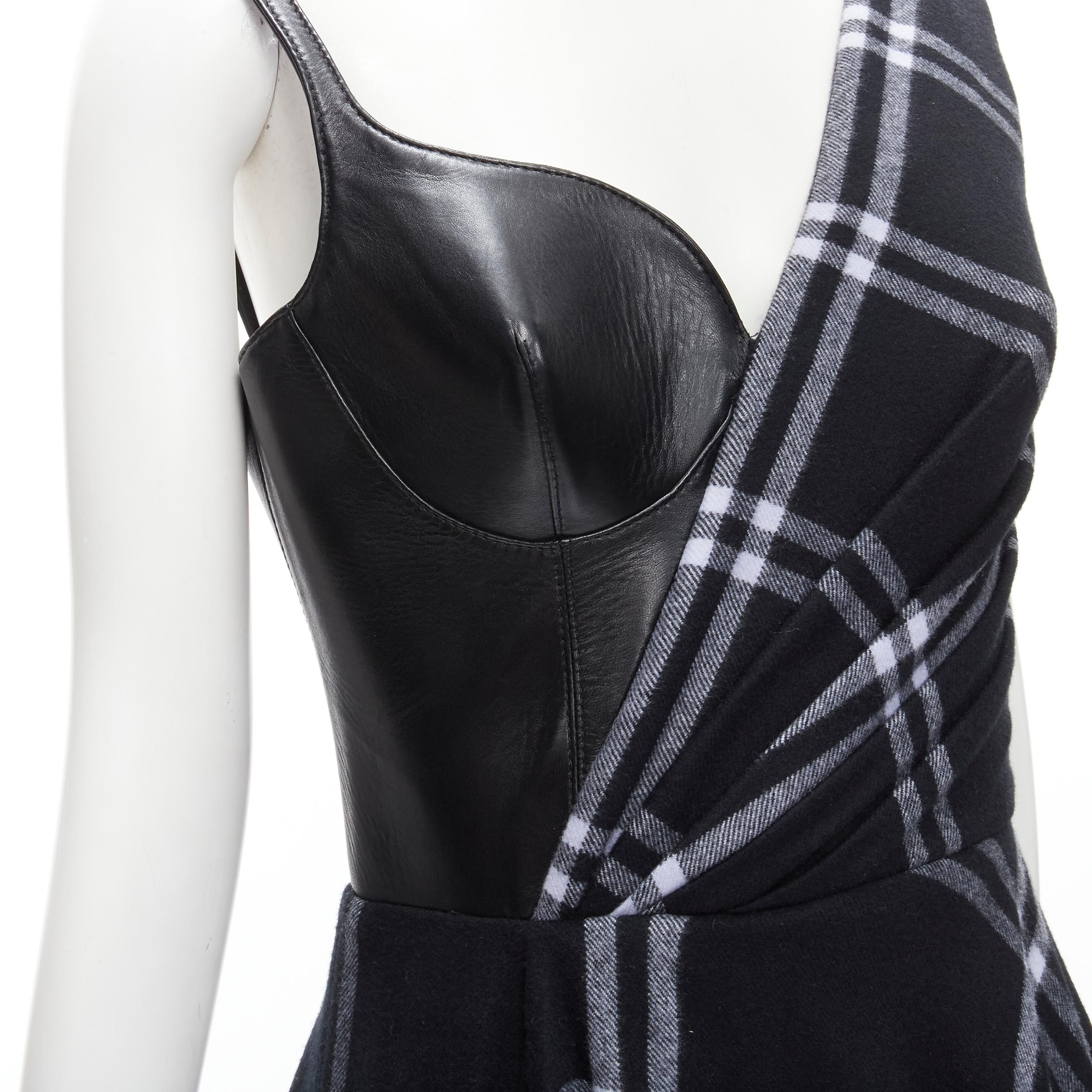 ALEXANDER MCQUEEN 2020 Runway black leather bust navy draped check dress IT42 M 
Reference: KEDG/A00161 
Brand: Alexander McQueen 
Designer: Sarah Burton 
Collection: Fall Winter 2020 Runway 
Material: Leather 
Color: Navy 
Pattern: Check 
Closure: