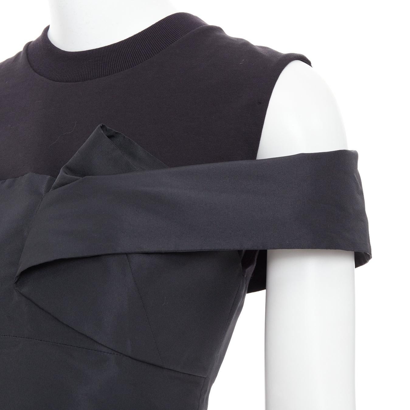 ALEXANDER MCQUEEN 2022 black draped cold shoulder taffeta crop top IT38 XS
Reference: AAWC/A01369
Brand: Alexander McQueen
Designer: Sarah Burton
Collection: SS2023
Material: Cotton, Polyester
Color: Black
Pattern: Solid
Closure: Zip
Lining: Black