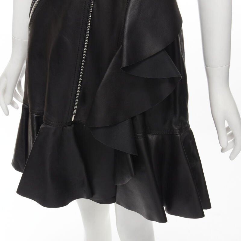 ALEXANDER MCQUEEN 2022 black leather biker belted ruffle trim dress IT38 XS
Reference: AAWC/A00036
Brand: Alexander McQueen
Designer: Sarah Burton
Material: Leather
Color: Black, Silver
Pattern: Solid
Closure: Zip
Lining:  Fully Lined
Extra Details: