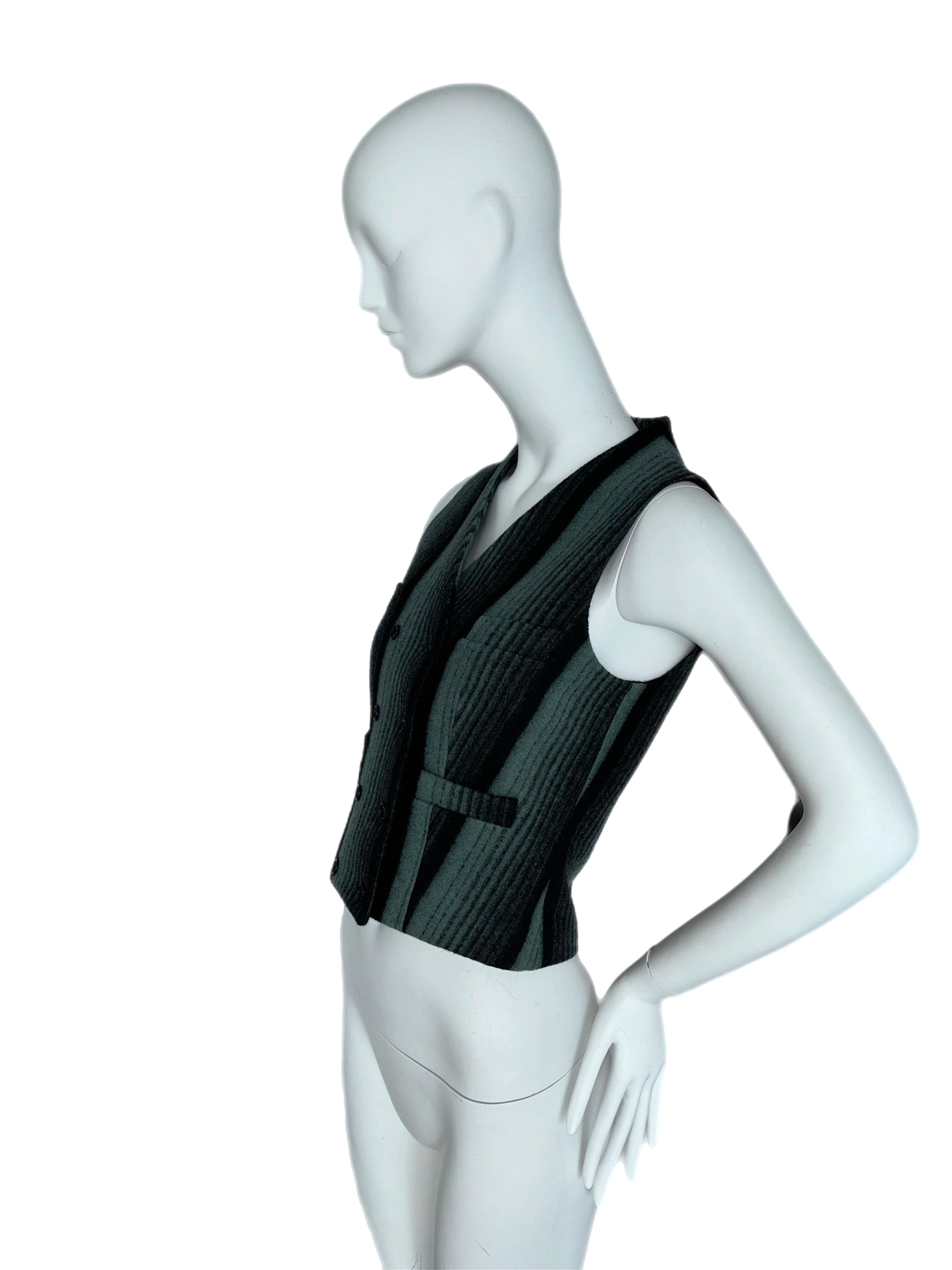 Alexander McQueen
Vintage
1990's
IT42
Excellent condition, no flaws
100% wool
Double-breasted

I would personally wear this vest with low-rise, low slung, looser jeans, and pair with kitten heels. I would keep the hair effortless and wear naturally