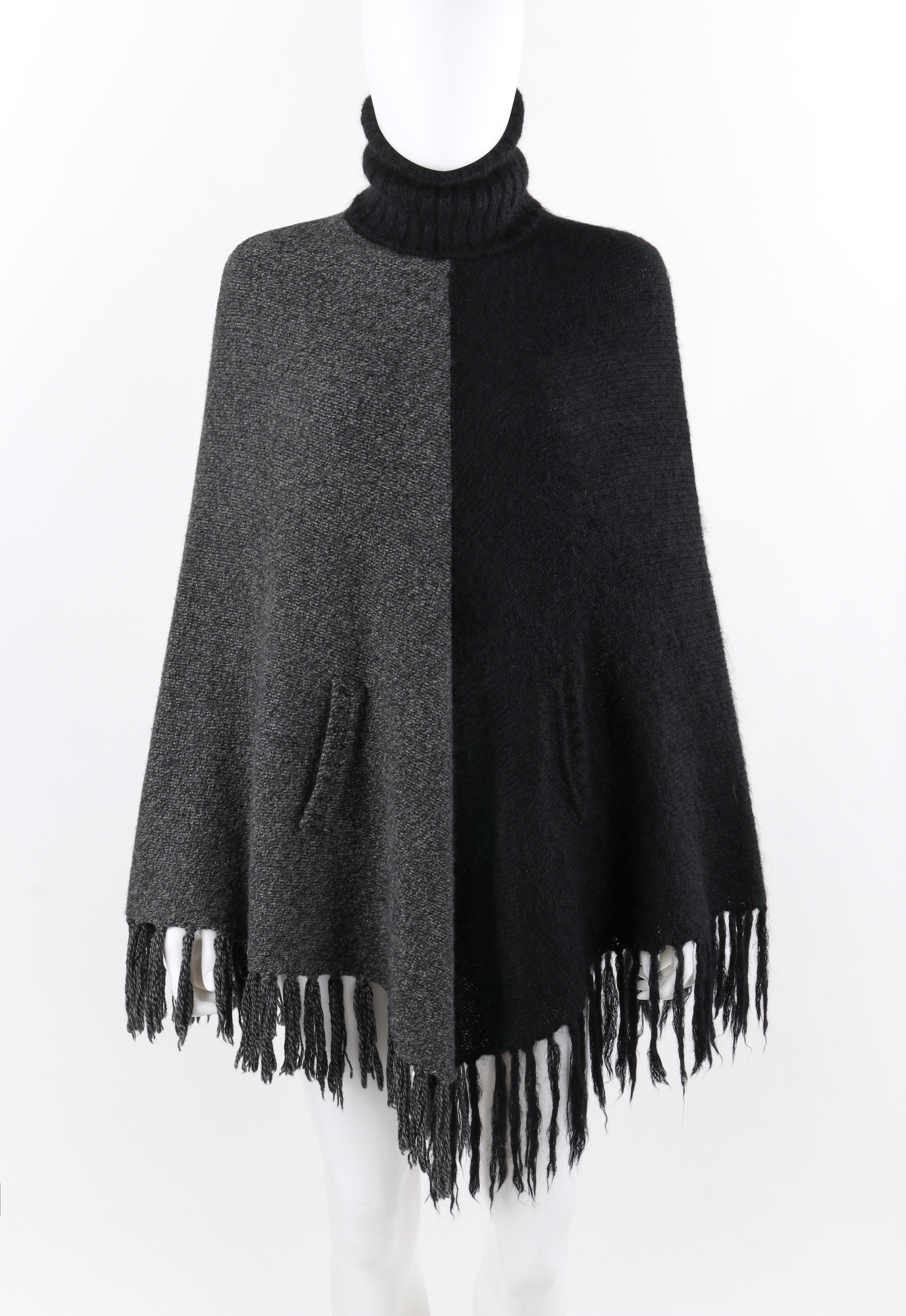 ALEXANDER McQUEEN A/W 1999 “The Overlook” Black Gray Knit Turtleneck Poncho Cape

Brand / Manufacturer: Alexander McQueen
Collection: A/W 1999 “The Overlook”
Designer: Alexander McQueen
Style: Turtleneck poncho cape
Color(s): Gray, black
Lined: