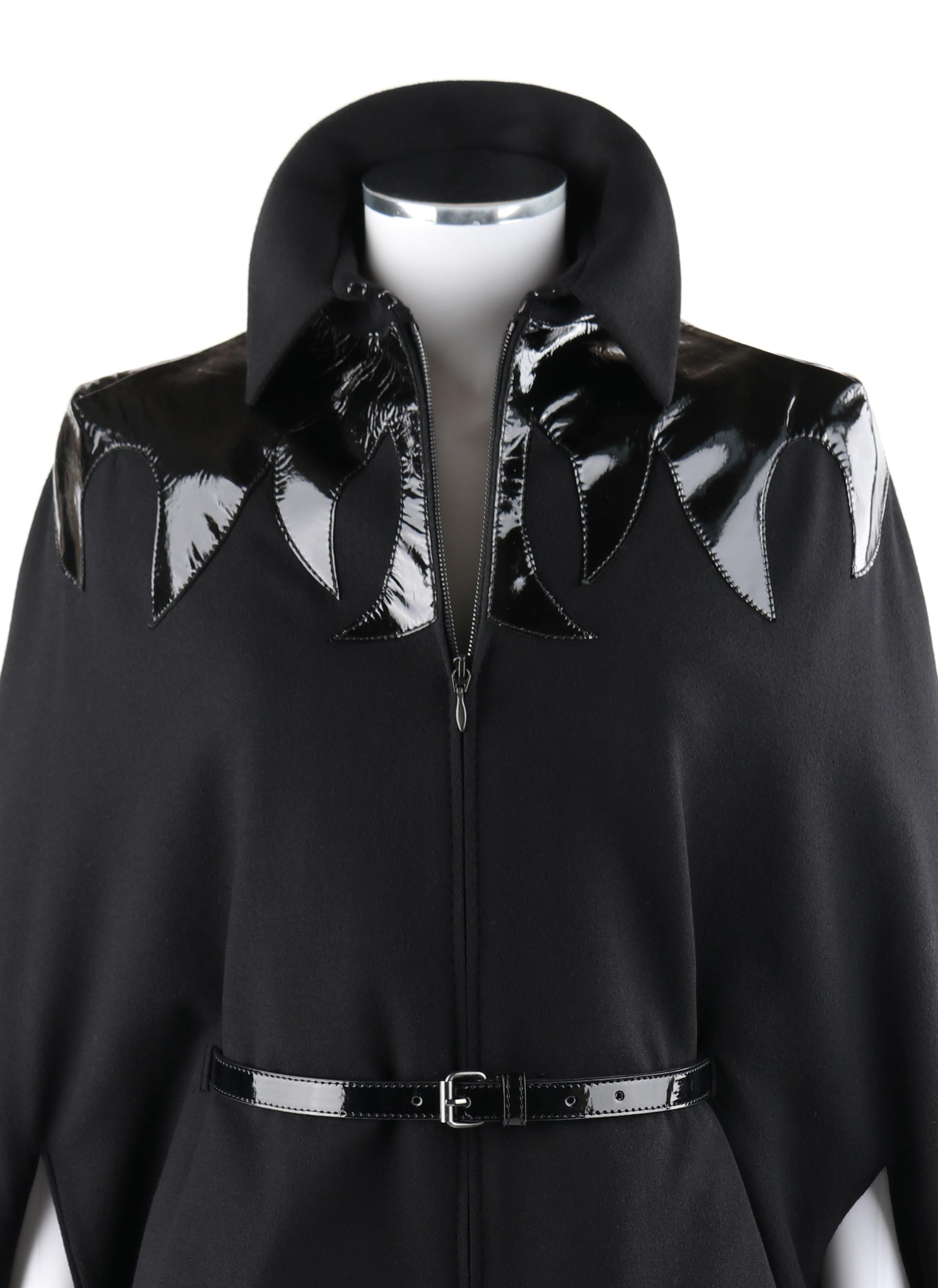 ALEXANDER McQUEEN A/W 2007 “Witches” Black Wool Patent Leather Detail Cape Coat

Brand / Manufacturer: Alexander McQueen 
Collection: A/W 2007 “Witches”
Designer: Alexander McQueen
Style: Mantel cape coat
Color(s): Black
Lined: Yes
Marked Fabric