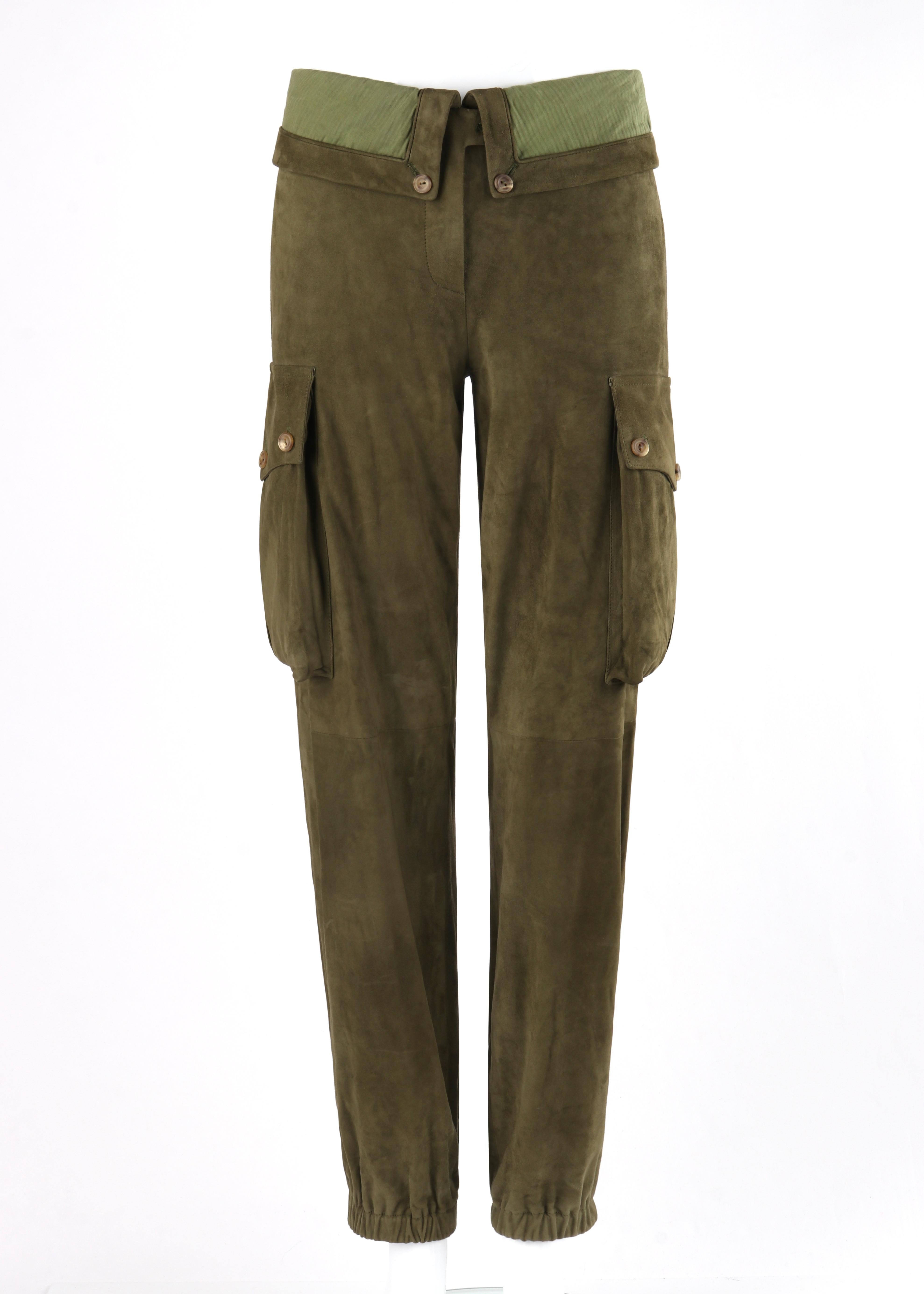 ALEXANDER McQUEEN A/W 2009 Army Green Suede Leather Cargo Pant Fold Over Joggers
 
Brand / Manufacturer: Alexander McQueen
Collection: A/W 2009 
Style: Cargo Joggers
Color(s): Shades of army green
Lined: Yes
Marked Fabric Content: Exterior “100%