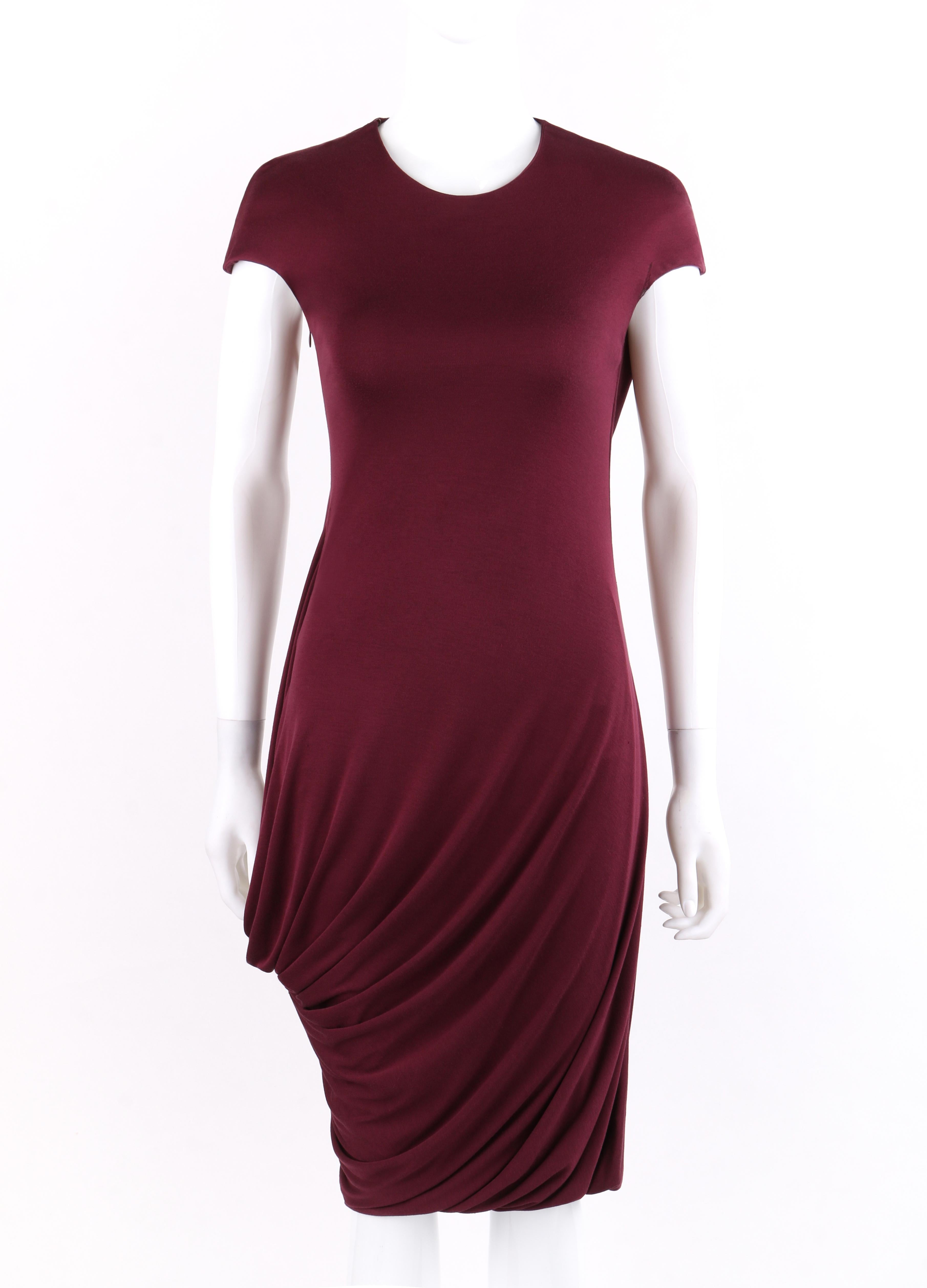 ALEXANDER McQUEEN A/W 2009 Burgundy Asymmetrical Draped Midi Dress
 
Brand / Manufacturer: Alexander McQueen 
Collection: Autumn / Winter 2009
Style: Midi dress
Color(s): Burgundy
Lined: Yes      
Marked Fabric Content: Composition: Rayon Viscose;