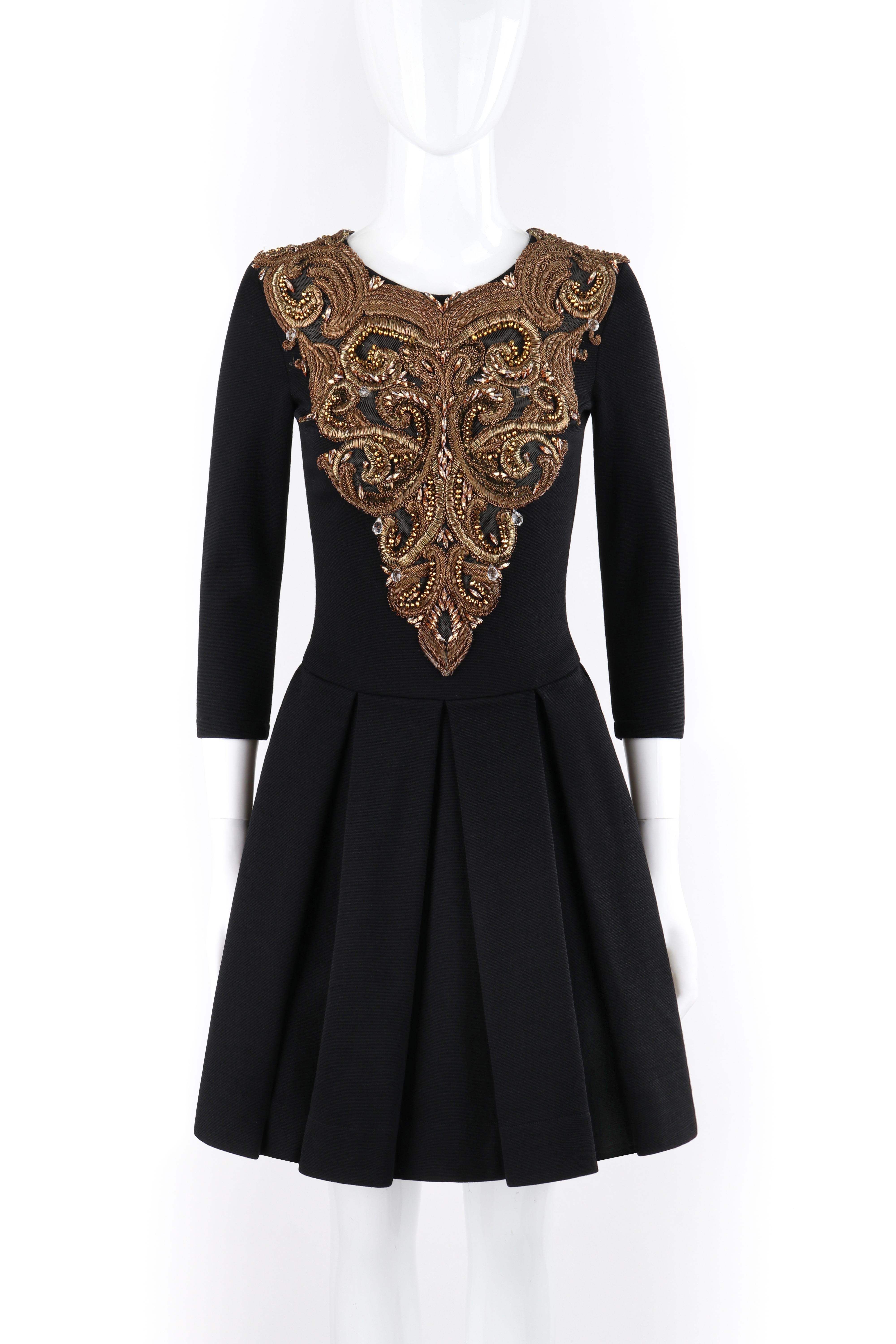 ALEXANDER McQUEEN A/W 2010 “Angels & Demons” Black Gold Beaded Fit n Flare Dress
 
Brand / Manufacturer: Alexander McQueen
Collection: A/W 2010 “Angels & Demons” 
Designer: Alexander McQueen 
Style: Fit ‘n flare dress
Color(s): Shades of black,