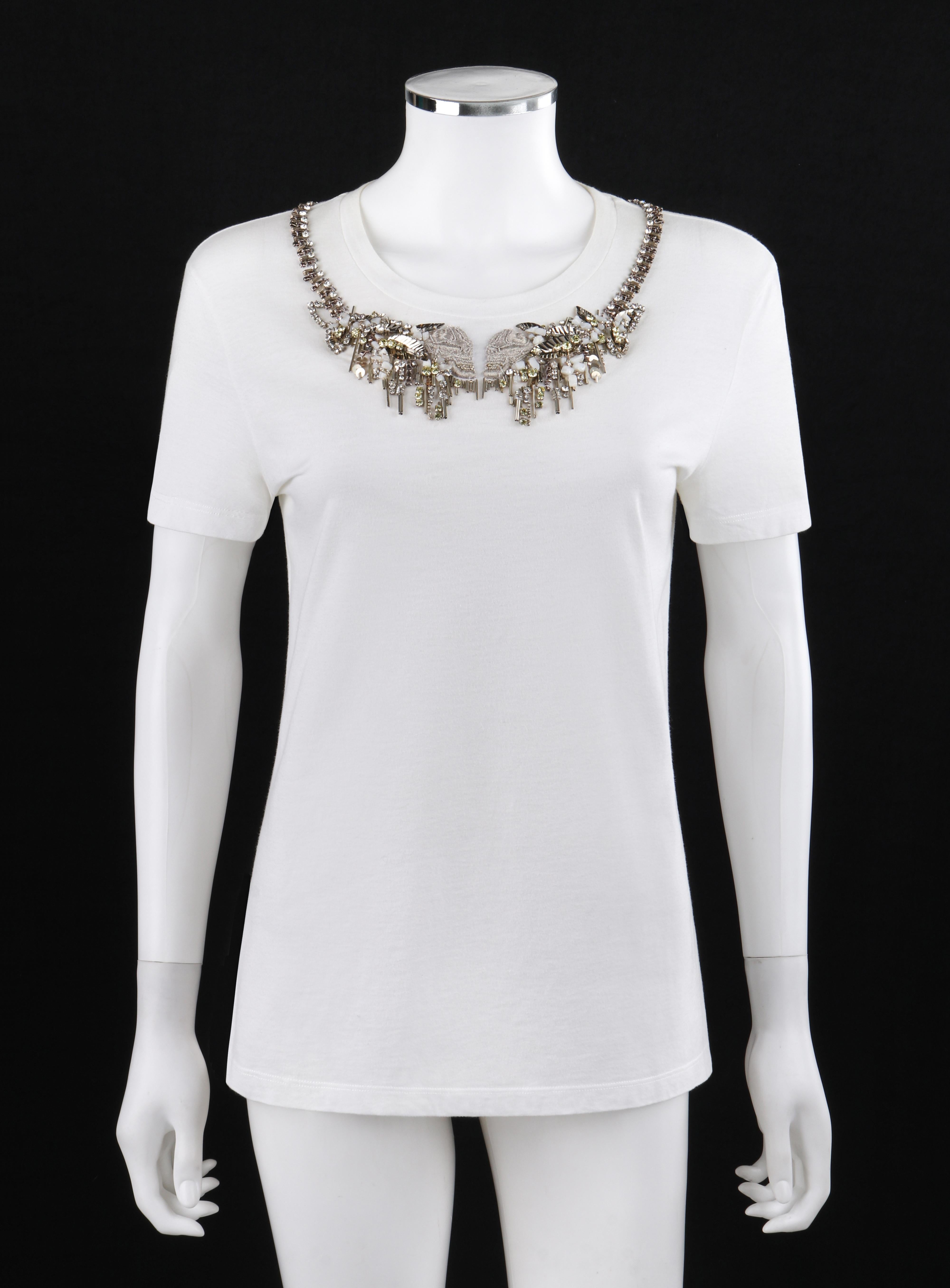 ALEXANDER McQUEEN A/W 2013 Skull Embroidered Beaded White Short Sleeve T-Shirt
 
Brand / Manufacturer: Alexander McQueen
Collection: A/W 2013
Style: T-shirt
Color(s): Shades of white and silver
Lined: No
Marked Fabric Content: 100% cotton
