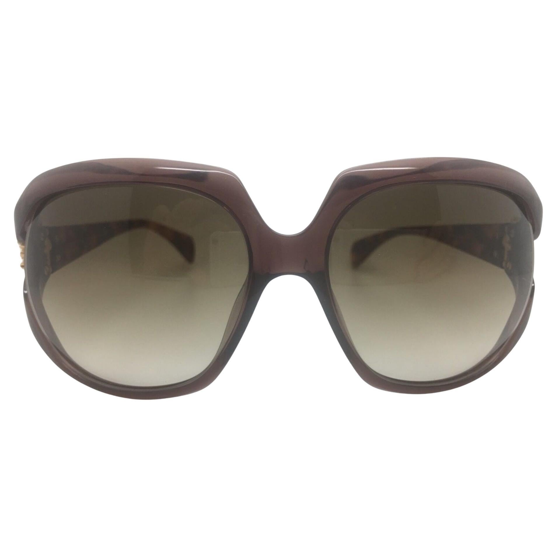 Who makes Alexander McQueen glasses?