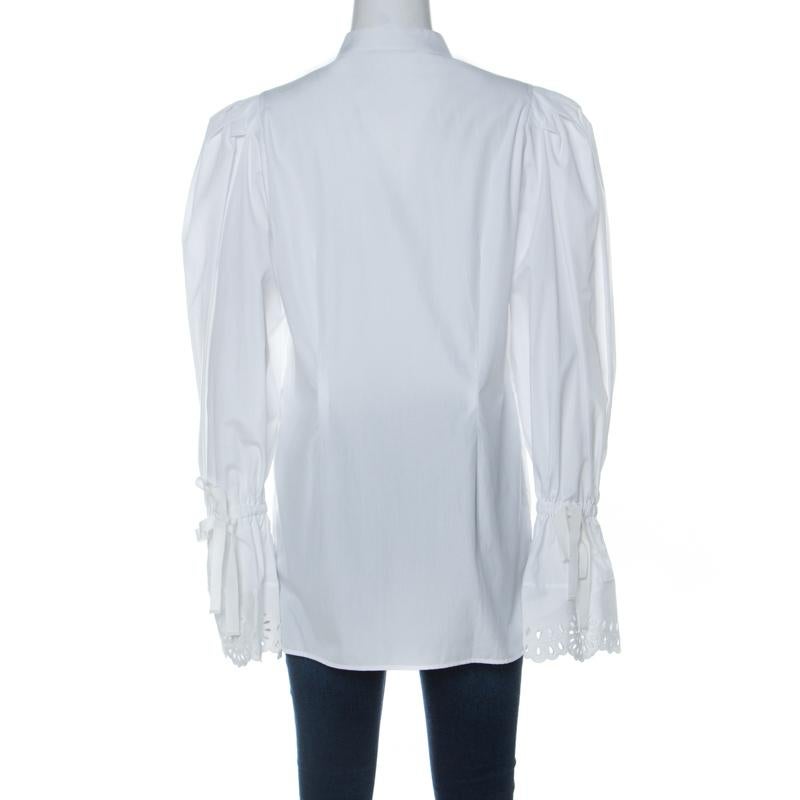 When it comes to wearing an Alexander McQueen creation, you are bound to make an impression! This shirt is made of 100% cotton and features an elegant silhouette along with a classic white shade. It flaunts long puffed sleeves in the bell shape,