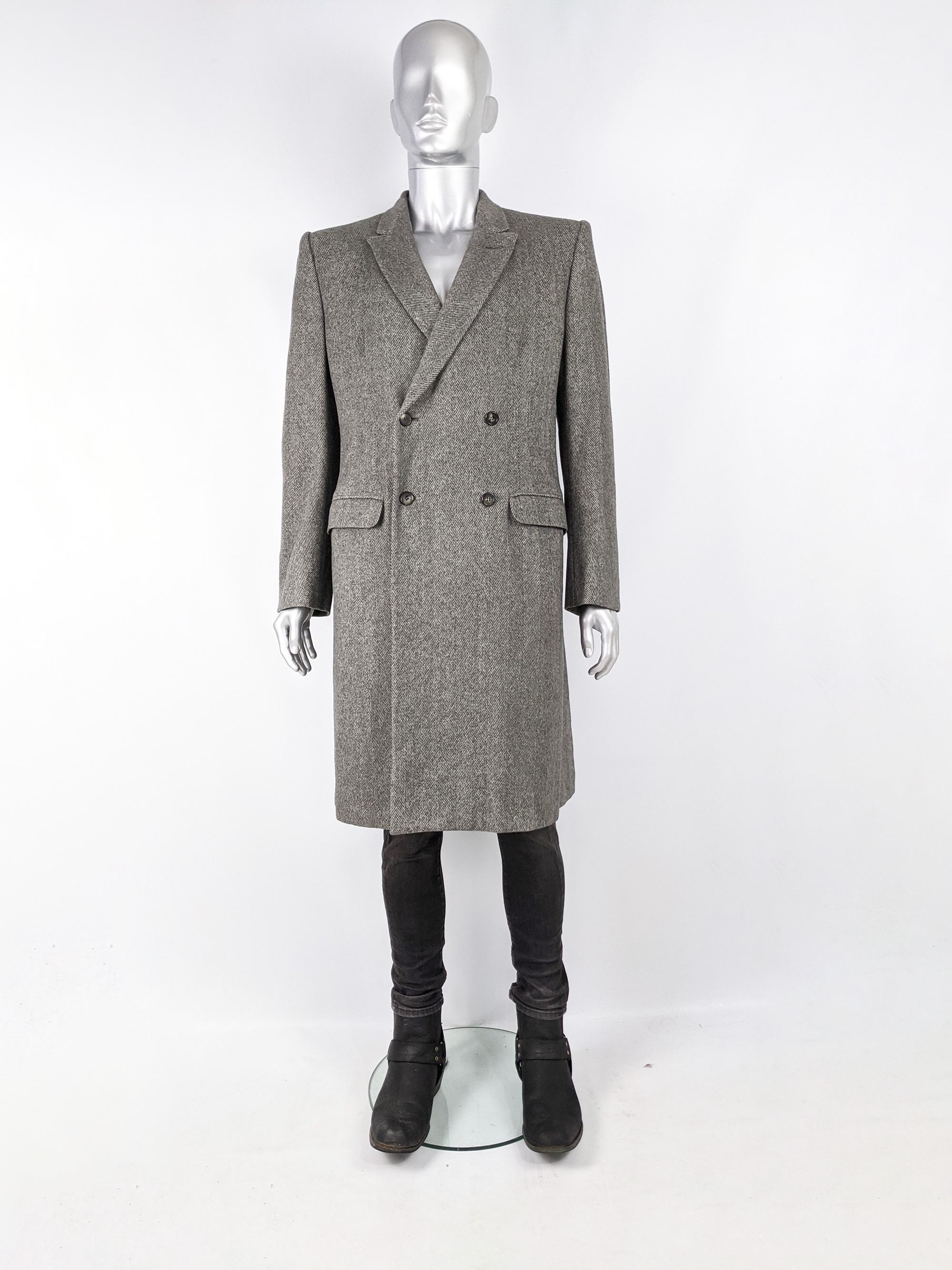 An incredible and rare archival mens Alexander McQueen coat from the Fall Winter 2007 collection as seen on the runway. Made in Italy from a luxuriously soft, pure cashmere with a herringbone tweed pattern. The lapels are a subtly rounded peak and
