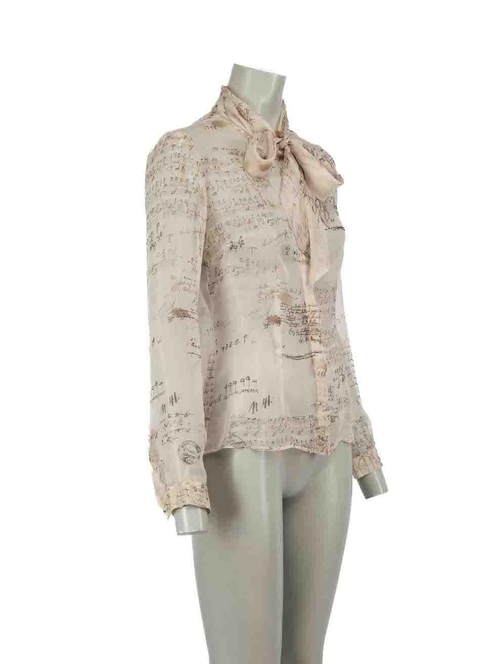 CONDITION is Very good. Minimal wear to blouse is evident. Minimal wear to the lining with the brand label having become detached on one side on this used Alexander McQueen designer resale item.

Details
Beige
Silk
Sheer blouse
Music notes printed