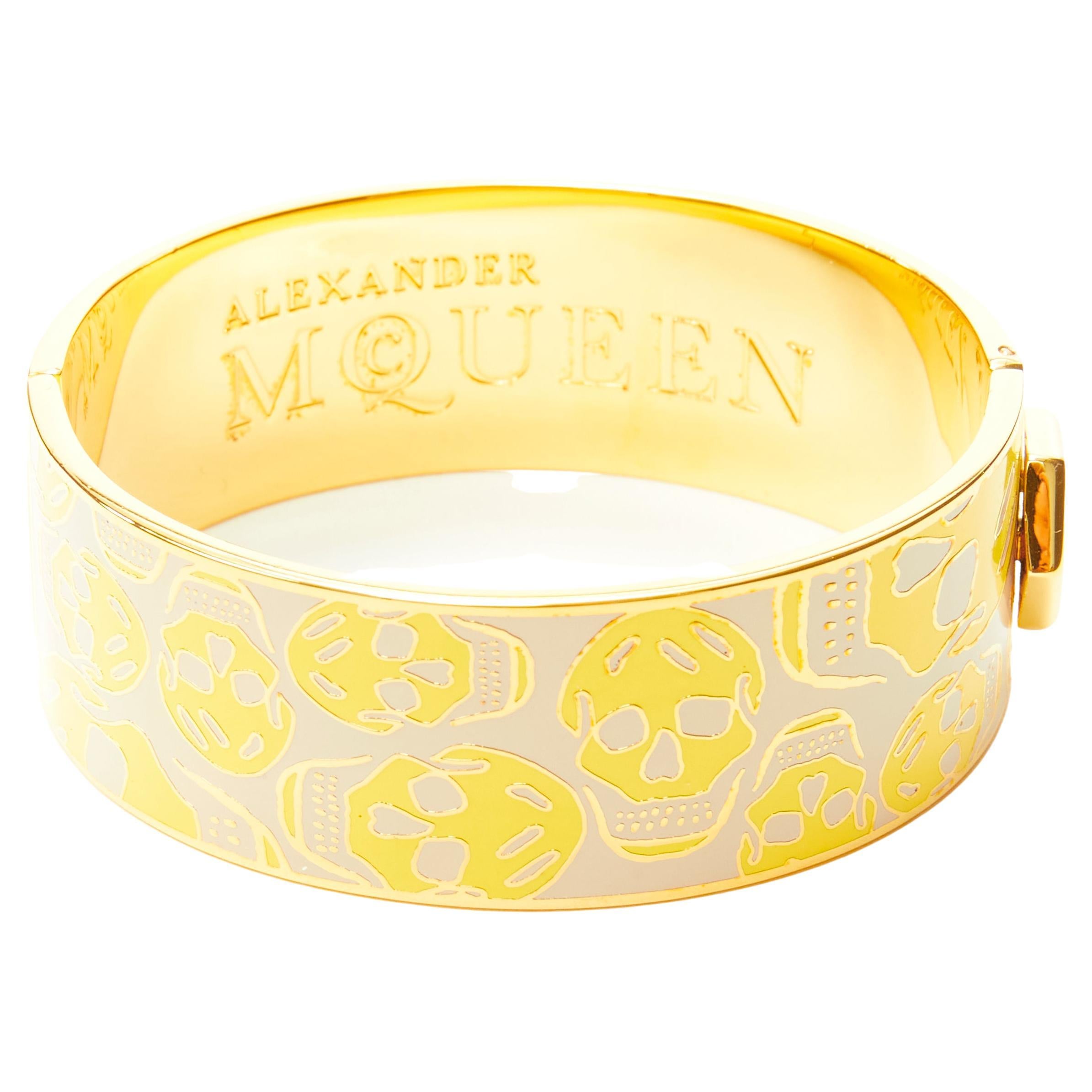 ALEXANDER MCQUEEN beige yellow skull enamel gold tone brass bangle cuff For Sale