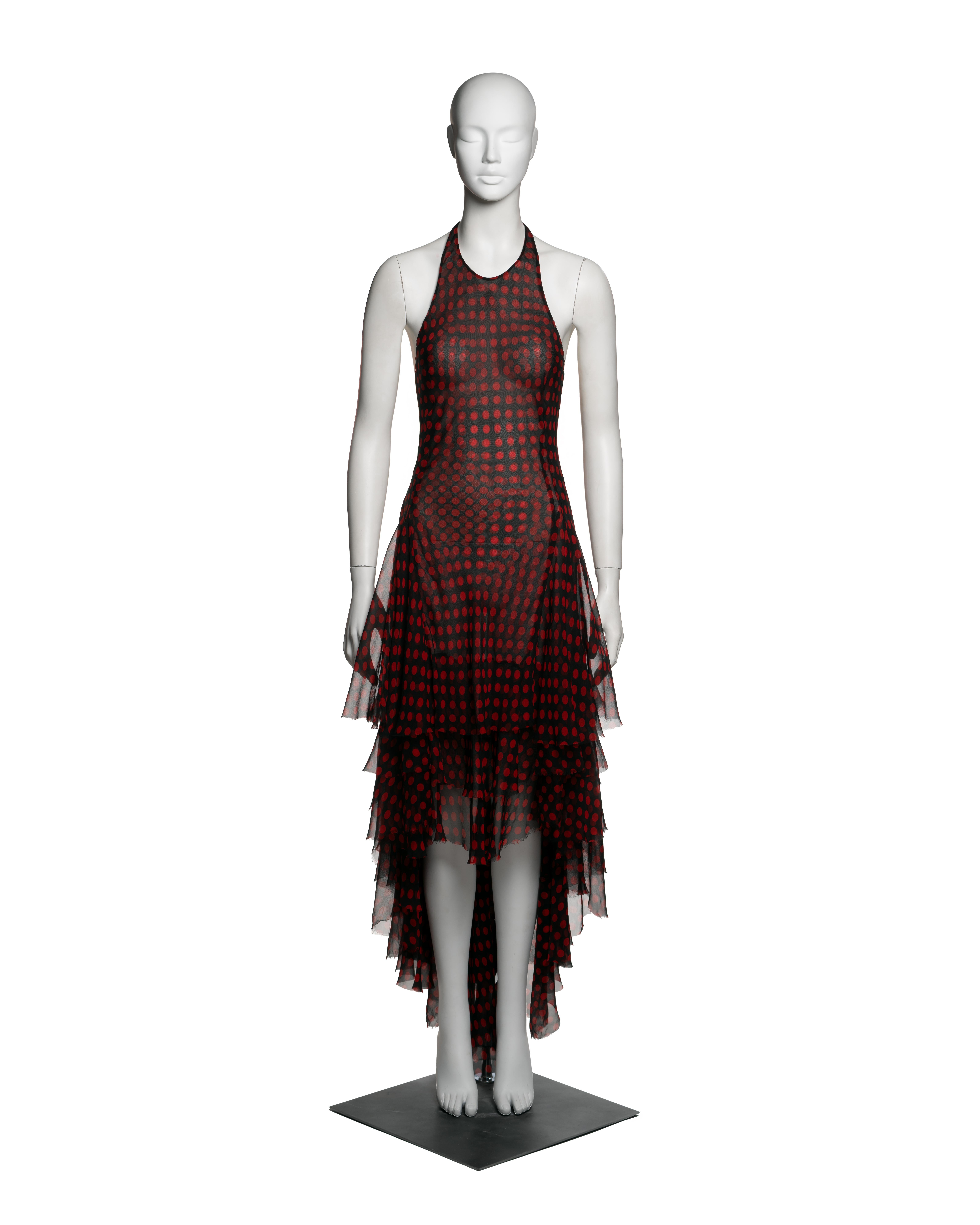 Alexander McQueen, Spring-Summer 2002. Bias-cut halter dress in double-layered silk chiffon, featuring a red polka dot print on a black ground. The sheer outer layer subtly reveals the underlayer’s identical polka dot pattern, creating a dimensional