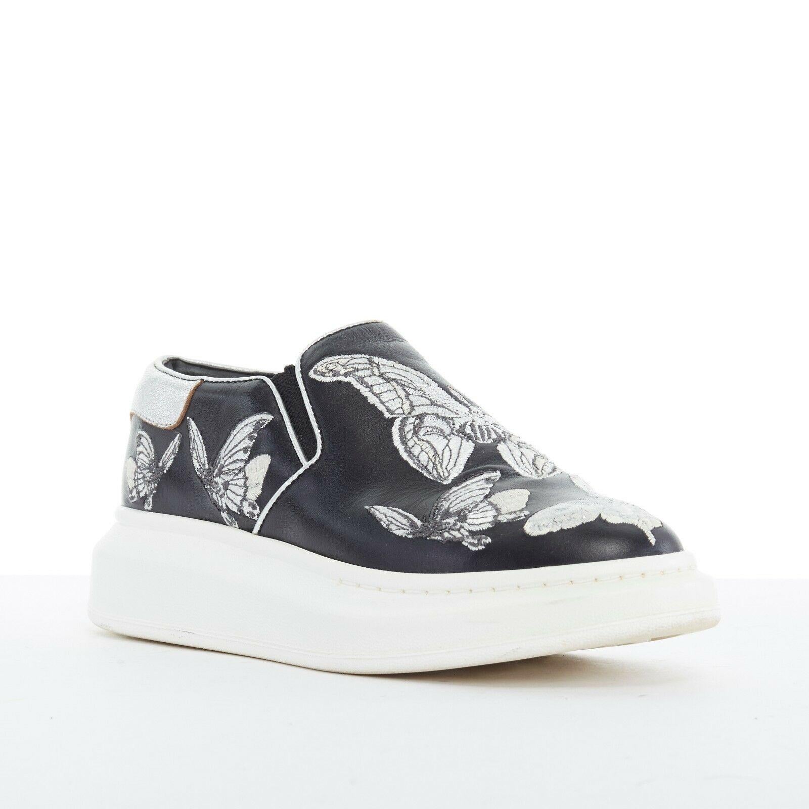 ALEXANDER MCQUEEN black butterfly embroidery leather chunky sole sneakers EU36.5
Brand: Alexander McQueen
Model Name / Style: Slip on sneakers
Material: Leather
Color: Black
Pattern: Other; butterfly
Extra Detail: Round Toe. Chunky heel.
Made in: