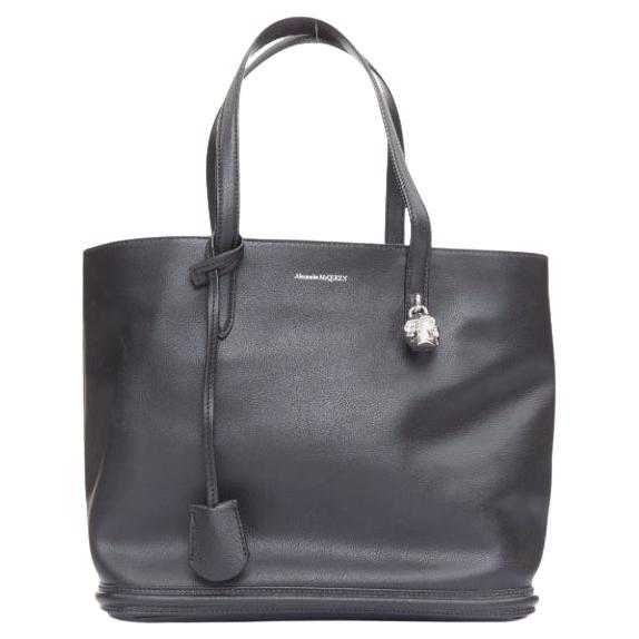 ALEXANDER MCQUEEN black calfskin leather silver skull lock tote bag