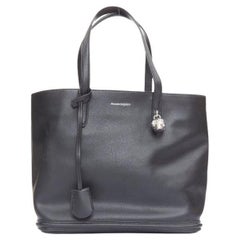 ALEXANDER MCQUEEN black calfskin leather silver skull lock tote bag