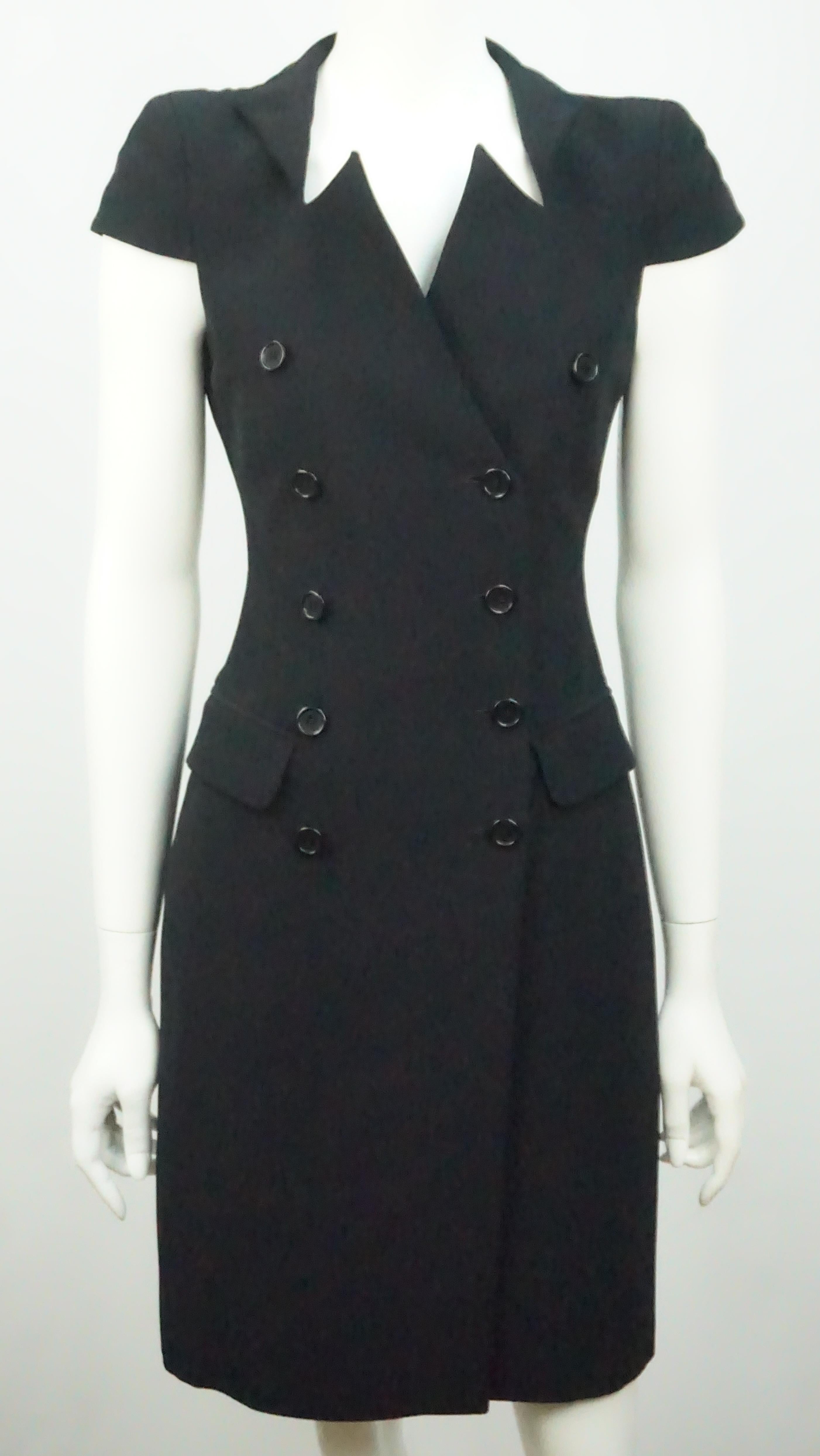 Alexander McQueen Black Double Breasted Cap Sleeve Dress - 38  This spectacular yet classic dress is a show stopper. The dress is a double breasted front with 10 front buttons of which 4 are functional. There are 2 interior buttons as well that help