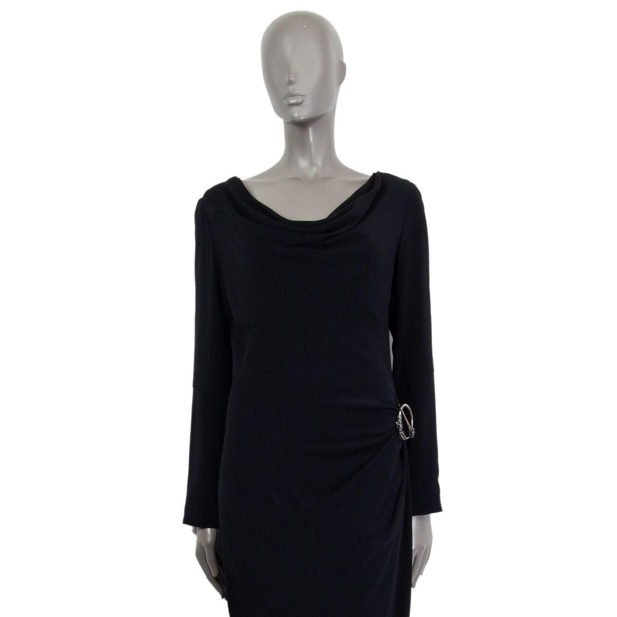 Alexander McQueen draped dress in black acetate (50%) and viscose (50%) with a cowl neck, long sleeves and a removable embossed brooch. Closes on the back with zipper. Lined in viscose (57%) and polyester (43%). Has been worn and is in excellent