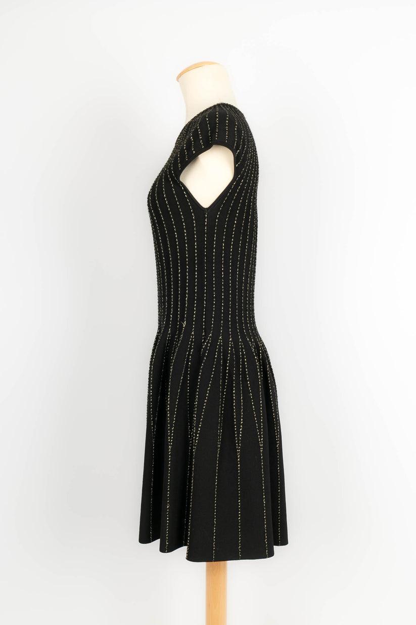 Alexander Mcqueen -Black dress with gold lurex threads. Size shown L.

Additional information: 
Dimensions: Shoulder width: 38 cm, Chest: 38 cm, Waist: 38 cm, Length: 92 cm
Condition: Very good condition
Seller Ref number: VR108