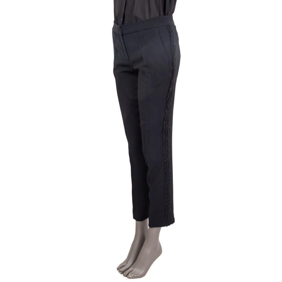 Alexander MCQueen embellished trim pants in black acetate (45%), viscose (48%) and silk (10%). Close on the front with a zipper and a hook fastener. Have been worn and are in excellent condition. See seperate listing for matching blazer. 

Tag Size