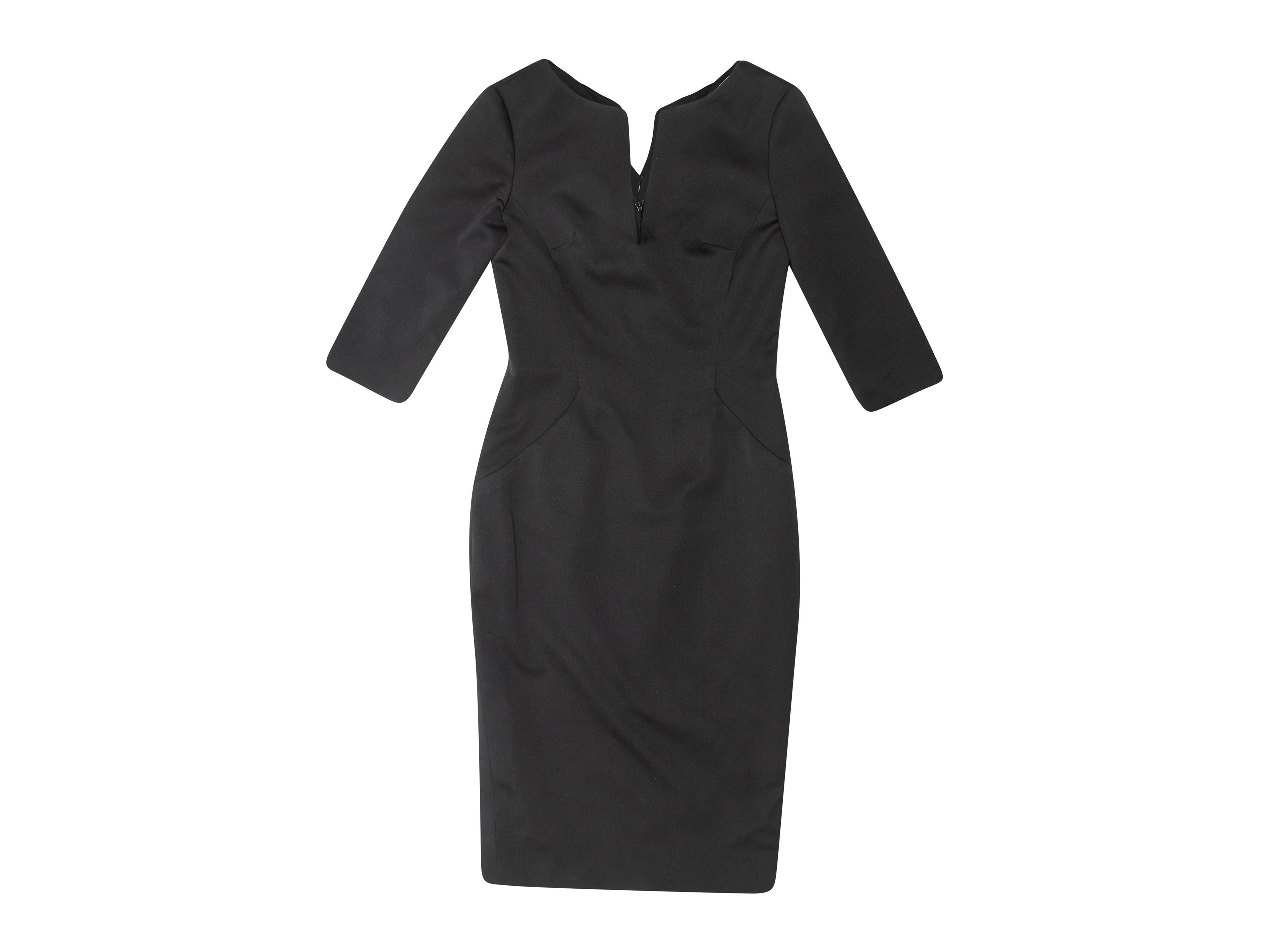 Product details: Black fitted dress by Alexander McQueen. V-neck. Three-quarter length sleeves. Zip closure at back. 42