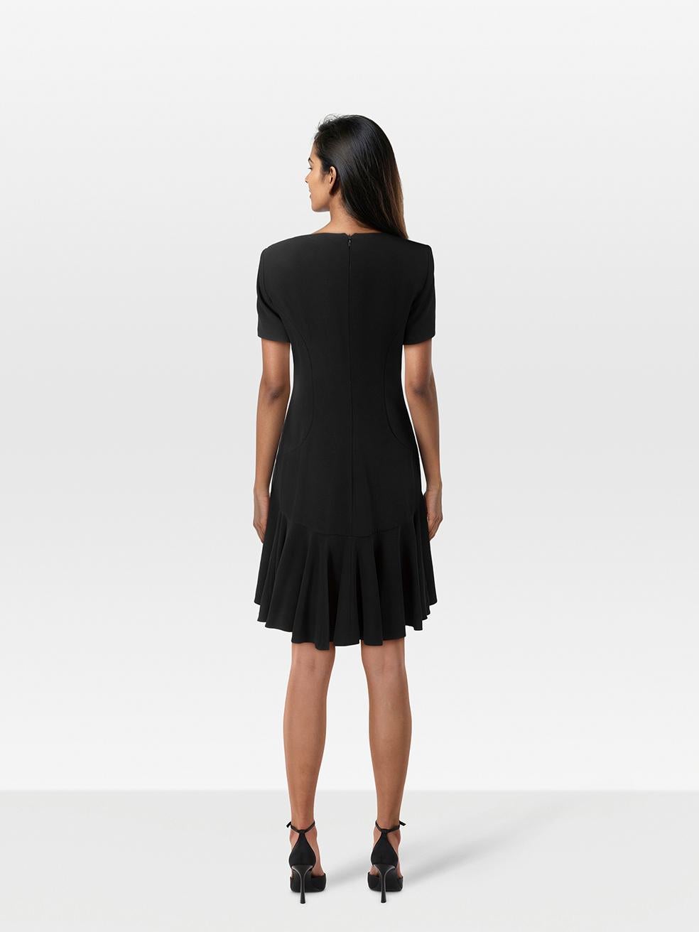 CONDITION is Very Good. Hardly any visible wear to the dress is evident on this used Alexander McQueen designer resale item.
 
 Details
 
 
 Black 
 
 Viscose
 
 Dress
 
 Knee length
 
 V neck
 
 Padded shoulders
 
 Flared skirt
 
 Short sleeves
 
