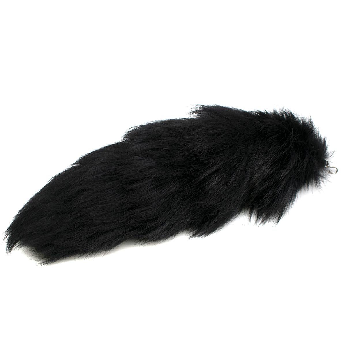 Alexander McQueen White Fox Fur Tail Charm

- 100% Dyed Fox Fur Charm
- Natural size from Finland 
- Silver toned hook attachment 
- Can be hung on necklaces, trousers, bags, keychains etc 

Please note, these items are pre-owned and may show some