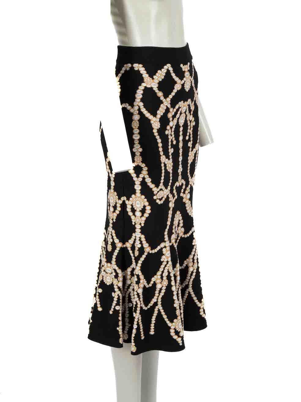 CONDITION is Never worn. No visible wear to skirt is evident on this new Alexander McQueen designer resale item.

Details
Black
Viscose
Flared skirt
Midi length
Knitted and stretchy
Glitter pearl pattern
Side zip closure with hook and eye
 
Made in