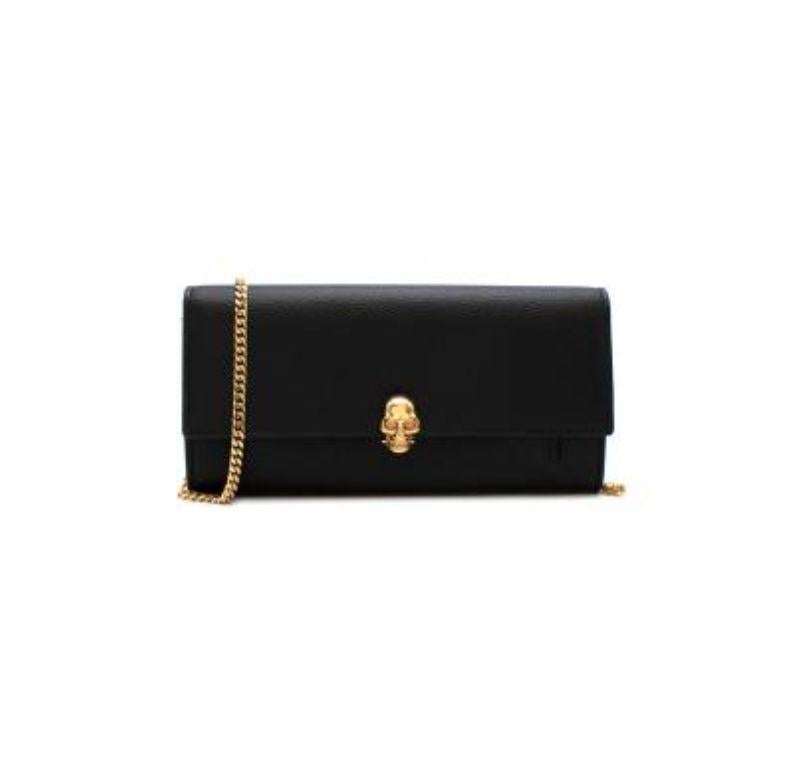 Alexander McQueen Black Grained Leather Continental Wallet on Chain

-Simple lines 
-polished gold skull clasp hardware, with gem embellishments 
-Gold thin detachable chain 
-Comes with box and dustbag
-One front exterior pocket 
-Multiple card