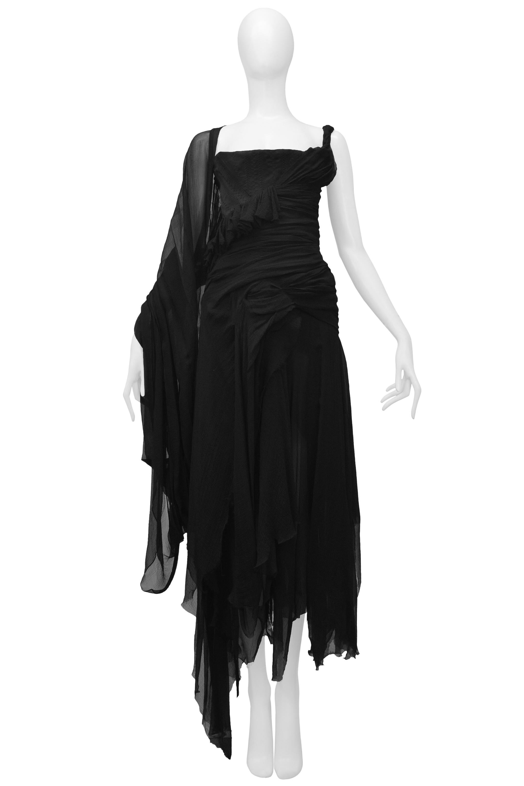 Resurrection Vintage is excited to offer an Alexander McQueen black chiffon dress featuring ruched chiffon along the front and back, buckle detail at the back, and a straight front neckline.
Alexander McQueen
Size 42
Silk Chiffon
2003 Irere
