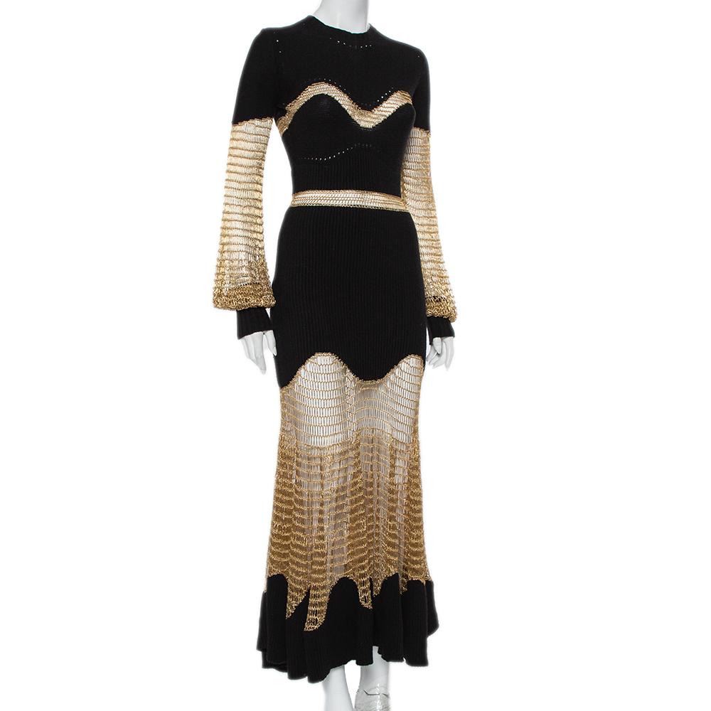 This visually stunning maxi dress is from Alexander McQueen and it delights with every detail. It is made from a blend of the finest materials and styled with metallic mesh panels. A creation as splendid as this one deserves to be yours right away.

