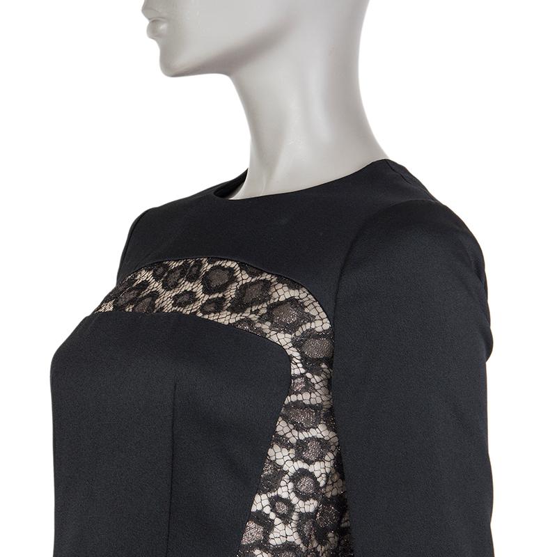Alexander McQueen lace-insert shirt in black acetate (68%) and rayon (32%) and lace in rayon (61%), polyamide (22%) and metallized fiber (17%) with pleated bottom. Opens with zipper on the back. Lined in black rayon (75%) and silk (25%).  Has been