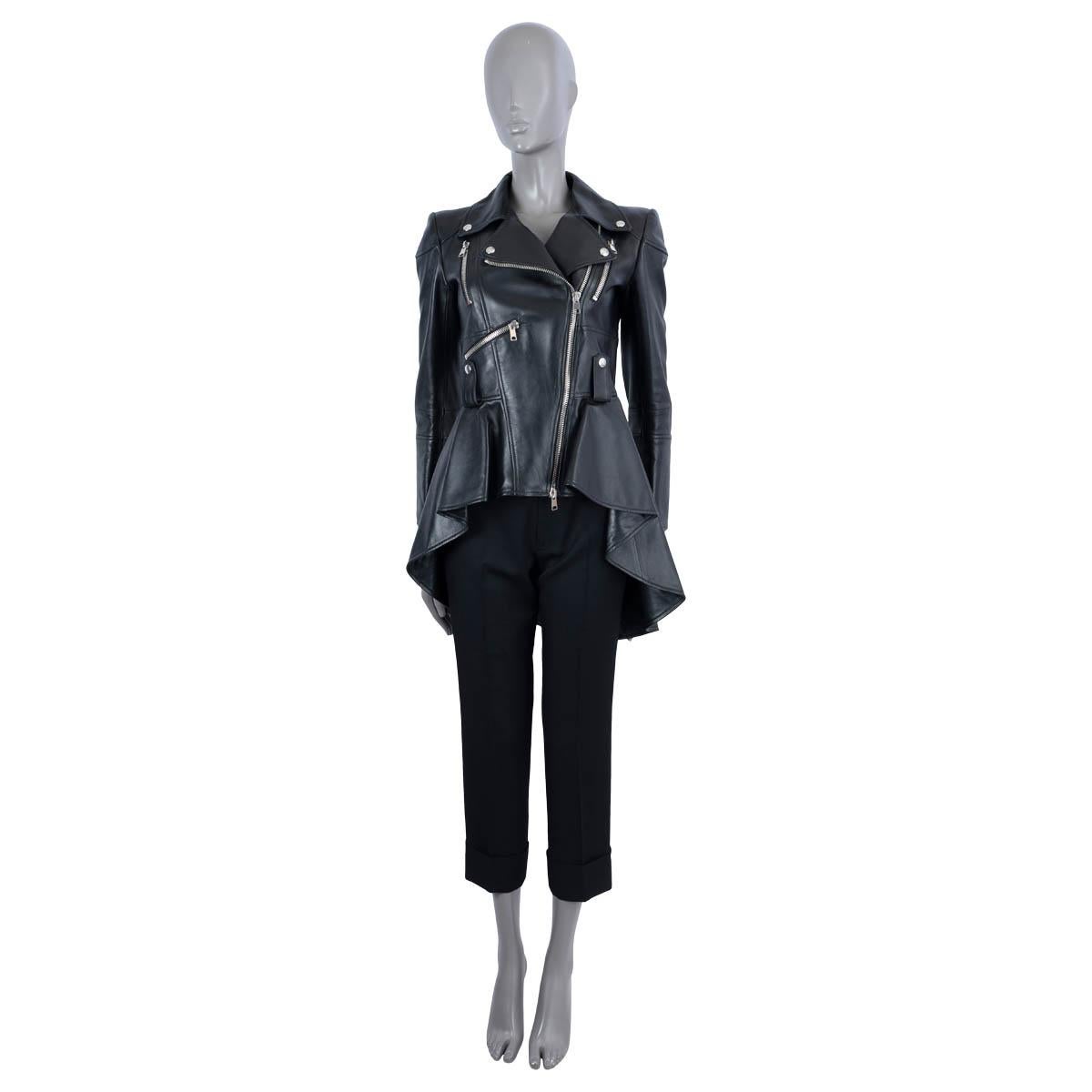 100% authentic Alexander McQueen peplum biker jacket in black leather (100%). Features with zippers at the cuffs, three zip pockets at the front and loop belts. Opens with a silver metal zipper on the front. Lined in black silk (100%). Has been worn