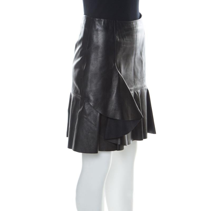 Edgy and quite different, this short skirt from Alexander McQueen definitely needs to be on your wishlist. The black skirt is made of 100% lamb leather with soft silk lining and features an artistic silhouette. It flaunts ruffles and sits perfectly