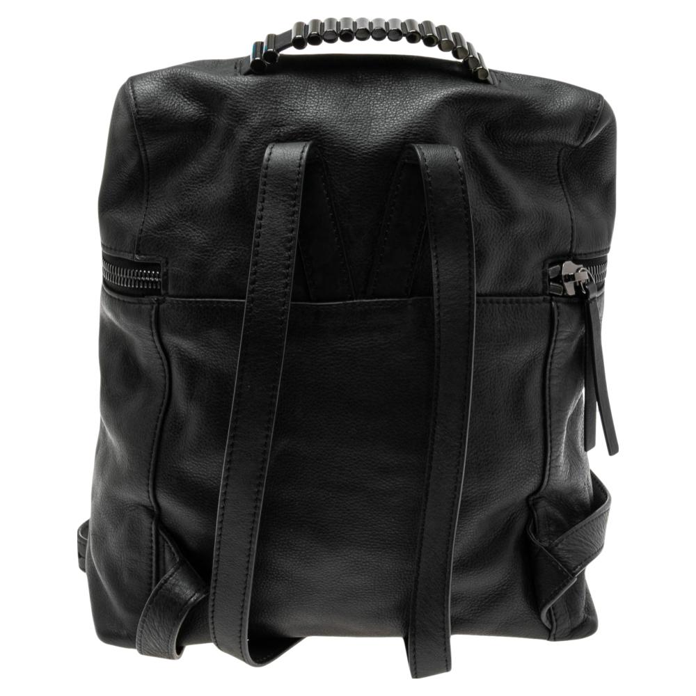 Easy to carry and convenient to use, this backpack from the House of Alexander McQueen will certainly prove to be a worthy investment. It is made from black leather on the exterior and displays black-toned hardware, a fabric-lined interior, and
