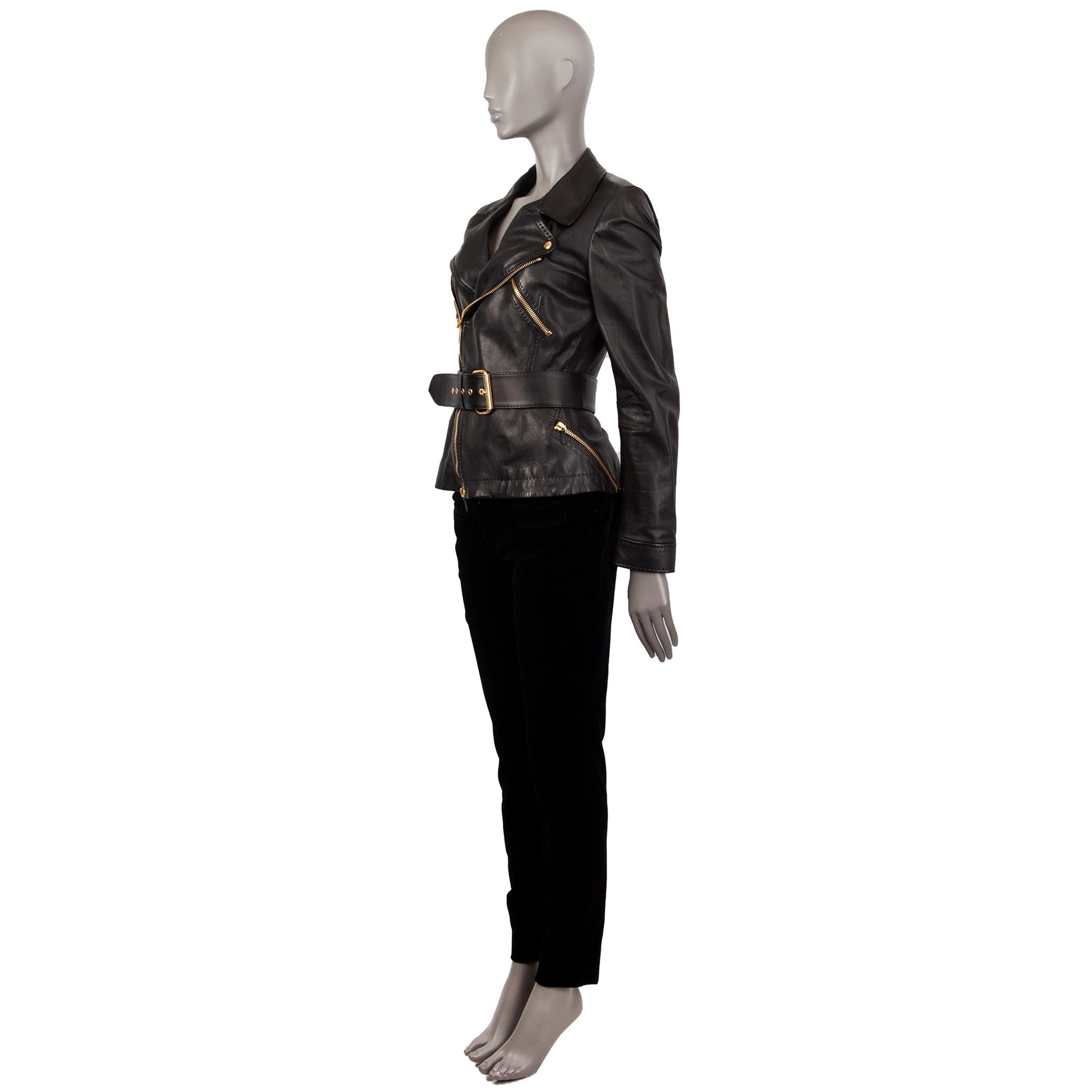 Alexander McQueen double.breasted  jacket in black leather. With buttoned notch colar, three zipper pockets on the front, zipper along the sleeves, and two-buttoon cuffs. Closes with two-way zipper in gold-tone metal on the front with leather pulls.