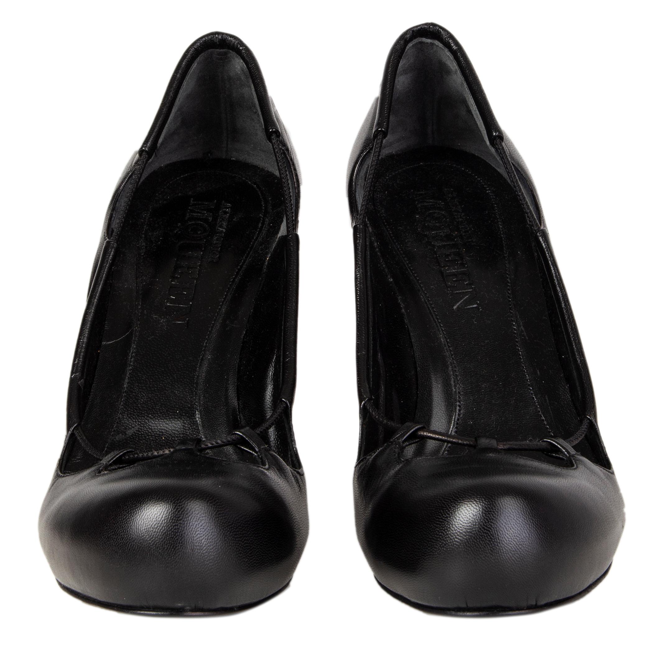 100% authentic Alexander McQueen 'Haze' pumps in black leather with cut-out details. Brand new. Come with dust bag. 

Measurements
Imprinted Size	39.5
Shoe Size	39.5
Inside Sole	25-.5
Width	7.5cm (2.9in)
Heel	10.5cm (4.1in)
Platform:	1.5cm