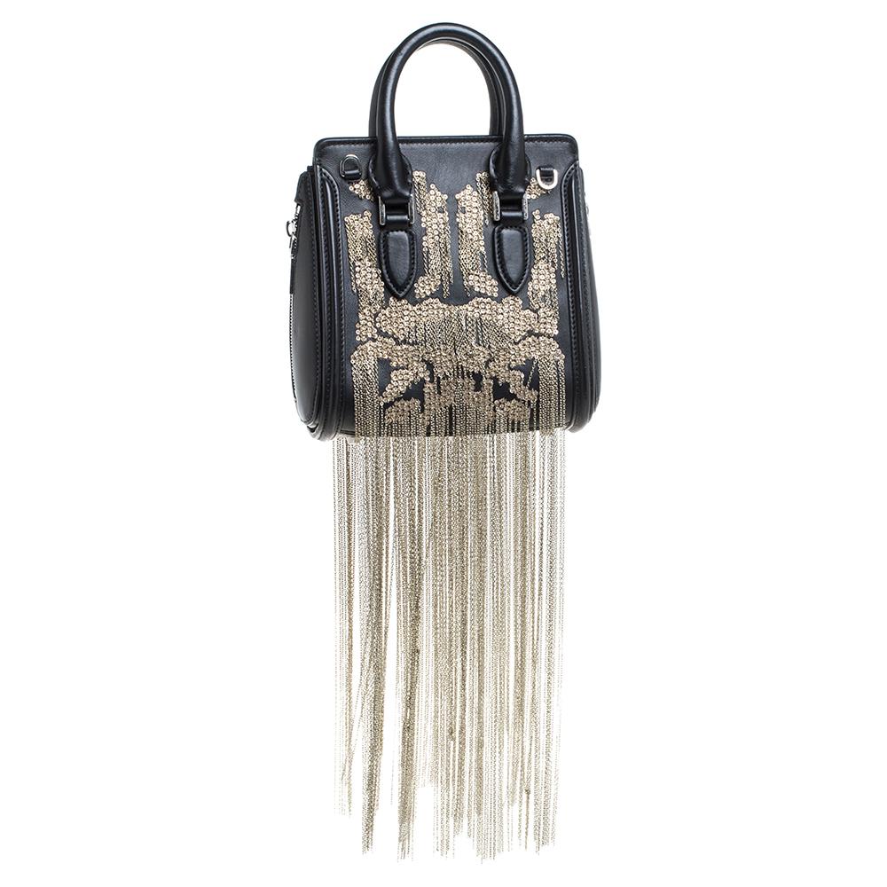 Every woman needs a bag that is pretty and functional, just like this glamorous Heroine bag from the iconic house of Alexander McQueen. Crafted from quality leather, it has been styled with a flap leading to a spacious suede interior and it is held