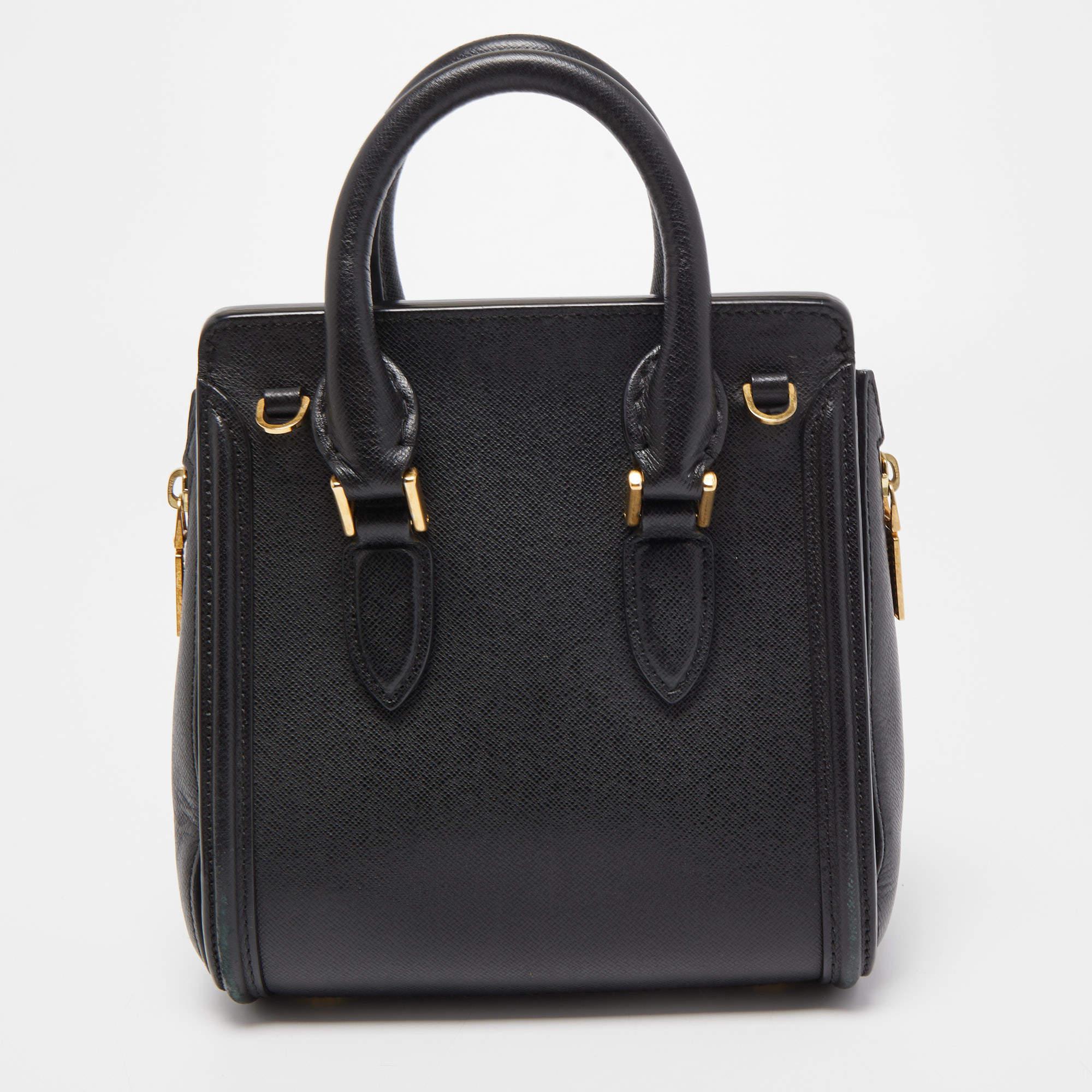 Stylish and easy to carry, this designer satchel will be a fine choice for work or after. Lined well, this pre-loved bag for women can easily fit all your essentials. It can be held in your arm or hand.

Includes: Detachable Strap