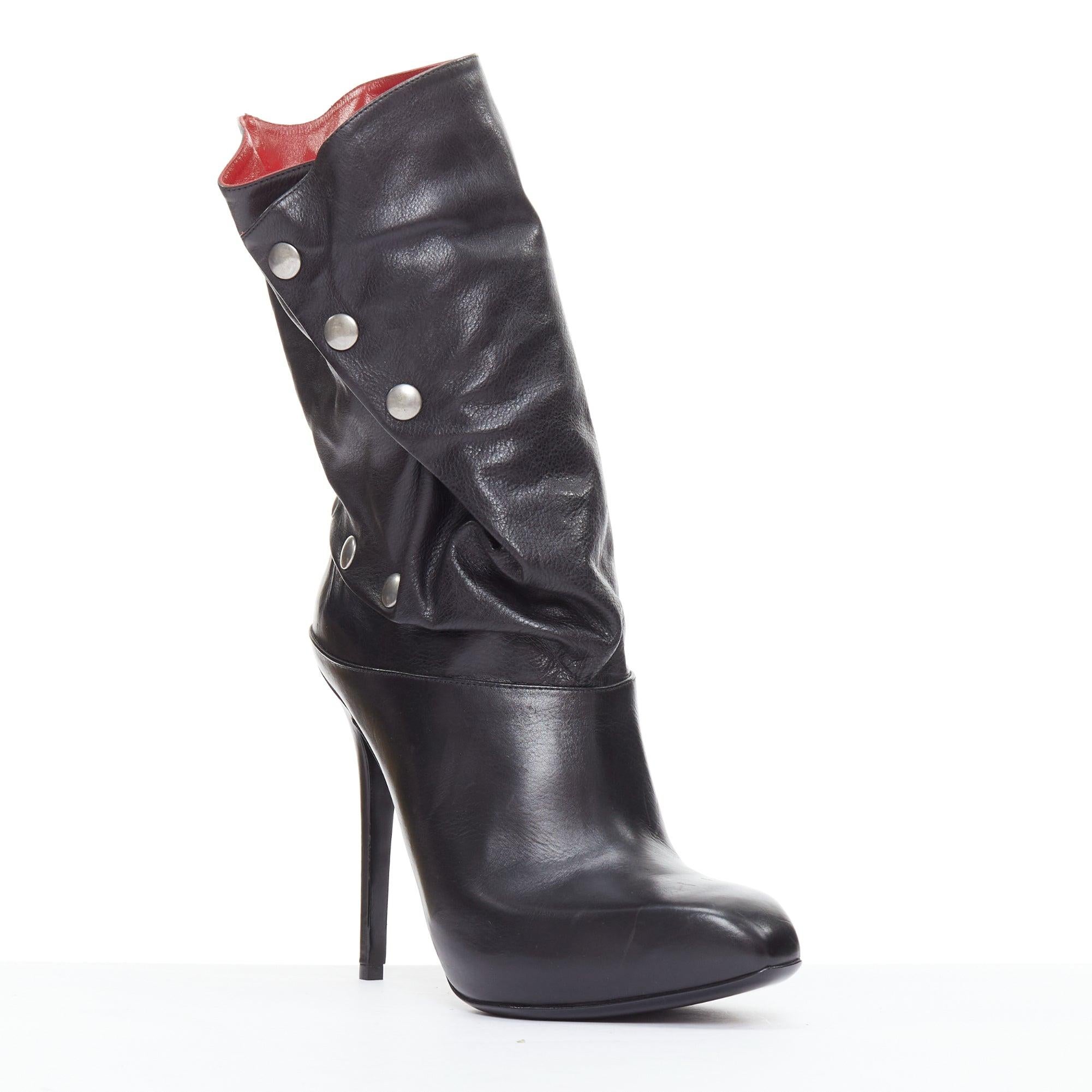 ALEXANDER MCQUEEN black leather red lined pirate biker ankle boots EU39
Reference: TGAS/E00301
Brand: Alexander McQueen
Designer: Lee Alexander McQueen
Material: Leather
Color: Black, Red
Pattern: Solid
Closure: Snap Buttons
Lining: Red