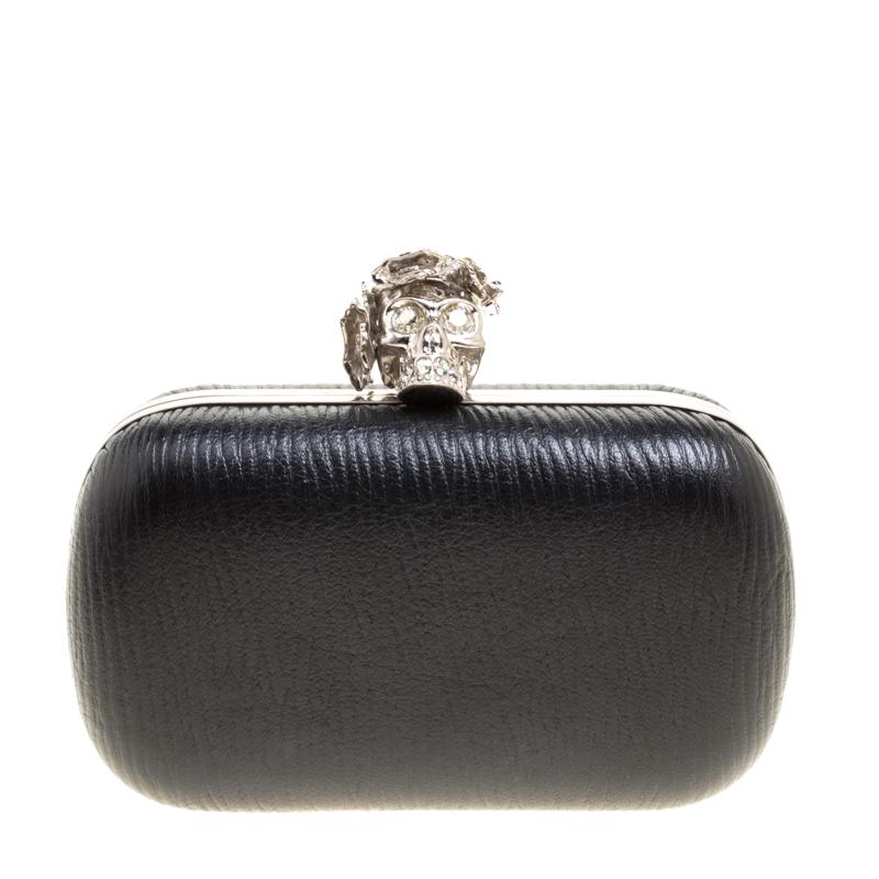 How utterly breathtaking is this clutch by Alexander McQueen! It is bold, well-crafted and overflowing with style. From the way it has been sculpted to the way it has been designed, this clutch makes a loud fashion statement with every detail. It