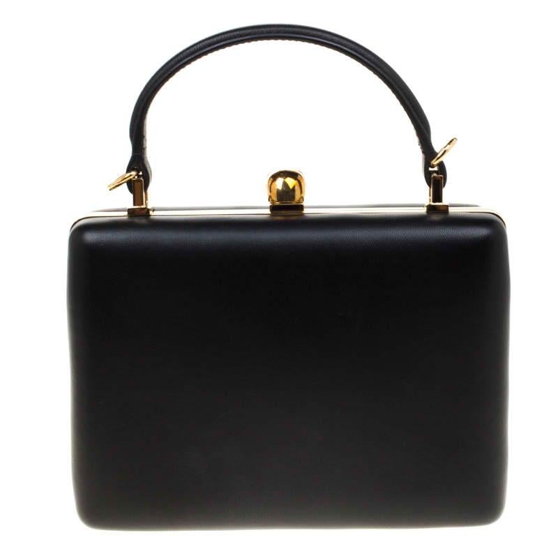 What joy it is to chance upon a bag as gorgeous as this one from Alexander McQueen. It comes beautifully crafted from black leather and designed with a gold-tone metal frame. It has the signature skull on top and a leather-lined interior that is