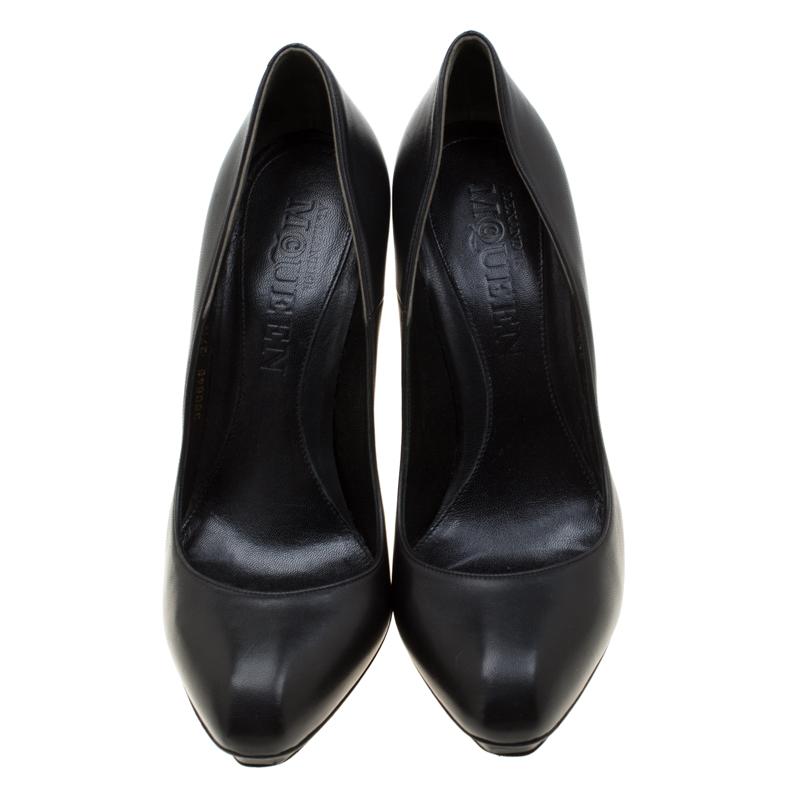 Style it up like a diva with this pair of pumps that have been designed from black leather for a sophisticated look. They feature a stylish stud detail at the heels that imparts a unique touch to the over-all look and makes sure you can stand out