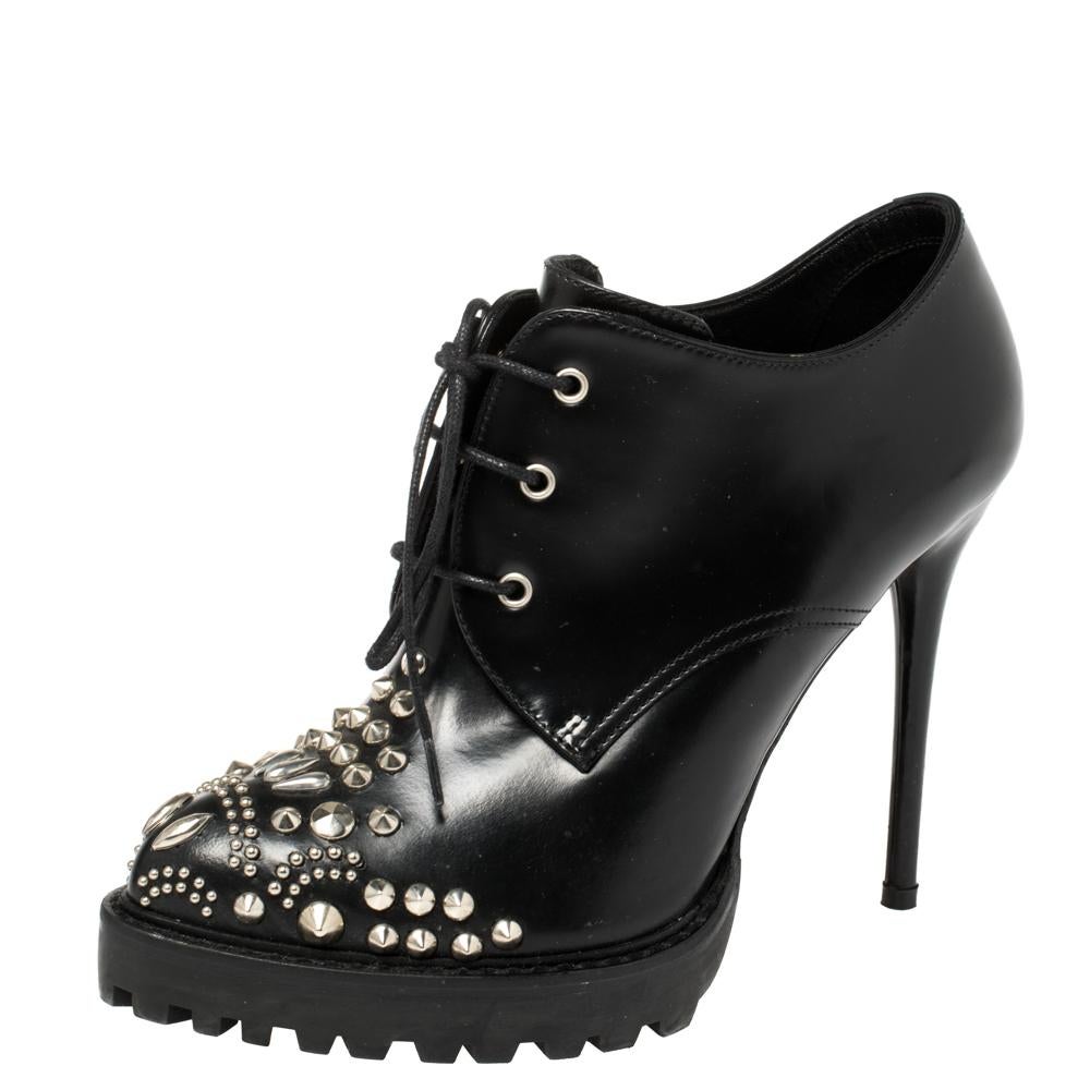 If you're someone who has a love for things that are edgy and unique, then Alexander McQueen's designs are perfect for you. These McQueen boots are anything but dull. Luxuriously crafted from stud-detailed leather, they feature pointed toes,