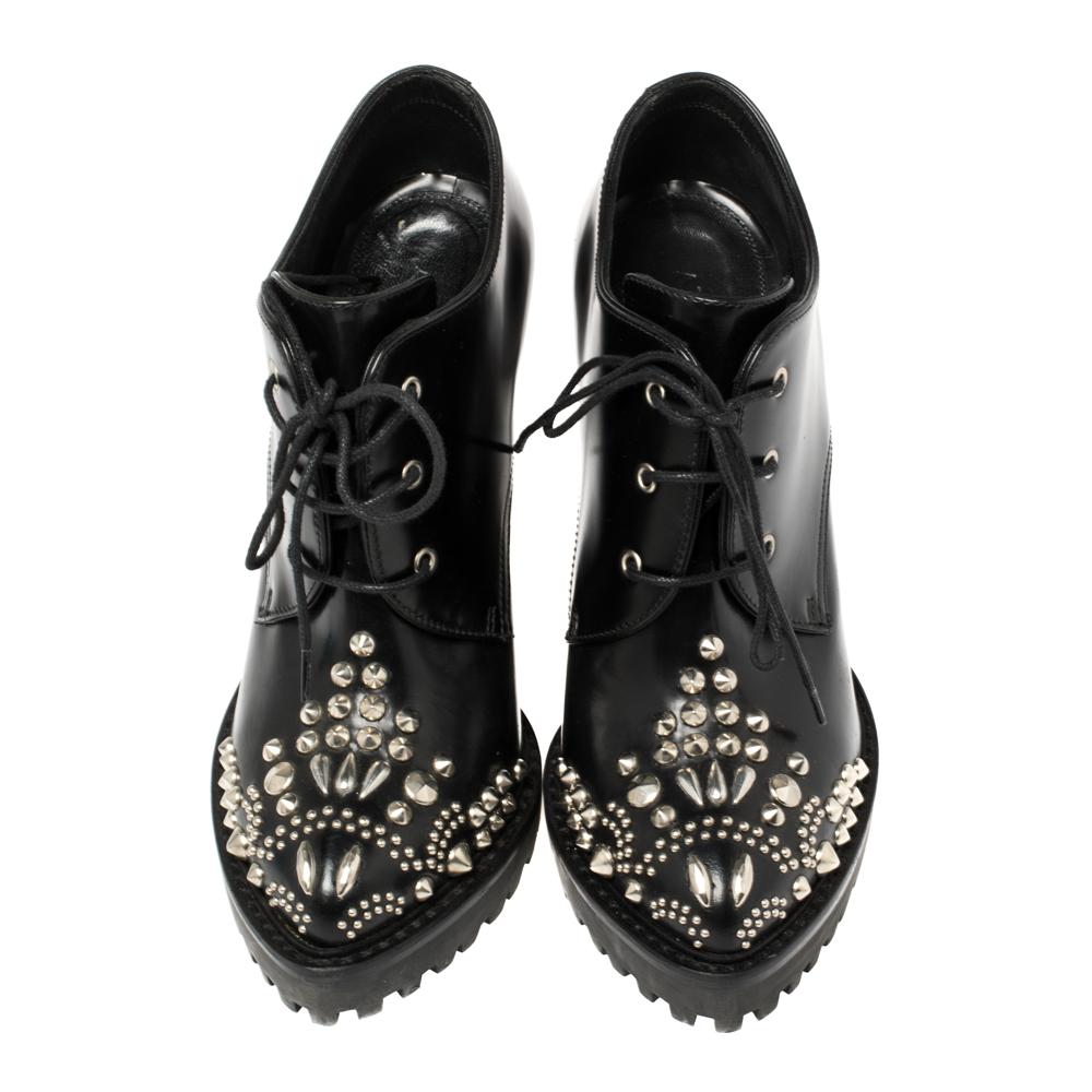 If you're someone who has a love for things that are edgy and unique, then Alexander McQueen's designs are perfect for you. These McQueen boots are anything but dull. Crafted from stud-detailed leather, they feature pointed toes, lace-ups, 11.5 cm