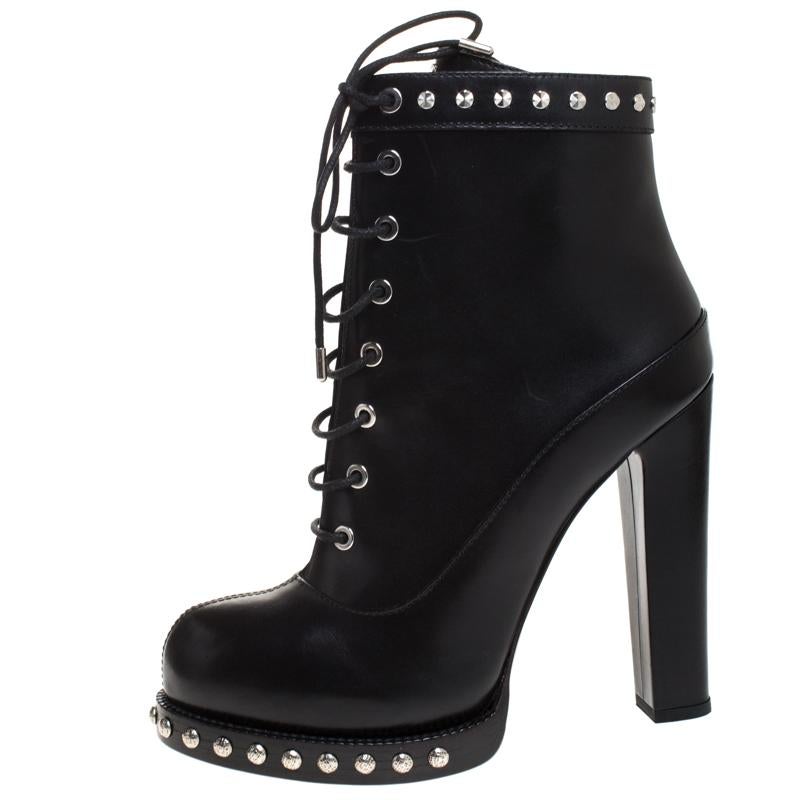 Noticeable stud detailing, raised platforms and high block heels define this grand pair of ankle boots from Alexander McQueen. Created using leather, the black pair has lace-up vamps, leather insoles and highly durable soles for lasting