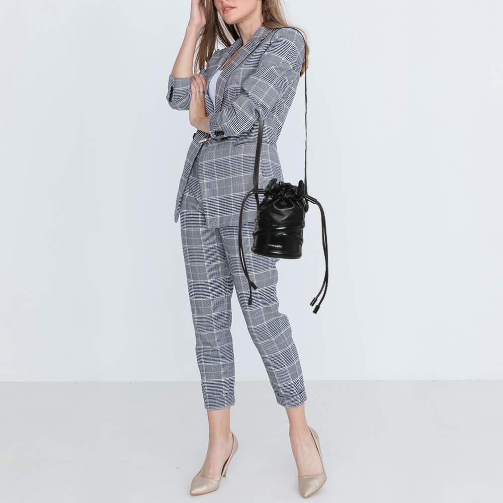 Brimming with artistry and quality craftsmanship  it is designed in a bucket silhouette  and the interior is spacious enough to hold all your essentials. This beautiful piece deserves to be carried with style by you.