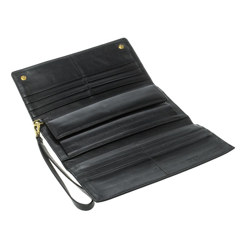 For those of you who love versatility in fashion comes the Alexander McQueen Black Leather Trifold Continental Wallet. This Stunning accessory has multiple slots and pockets for your various essentials and the trifold flaps are secured by a flap