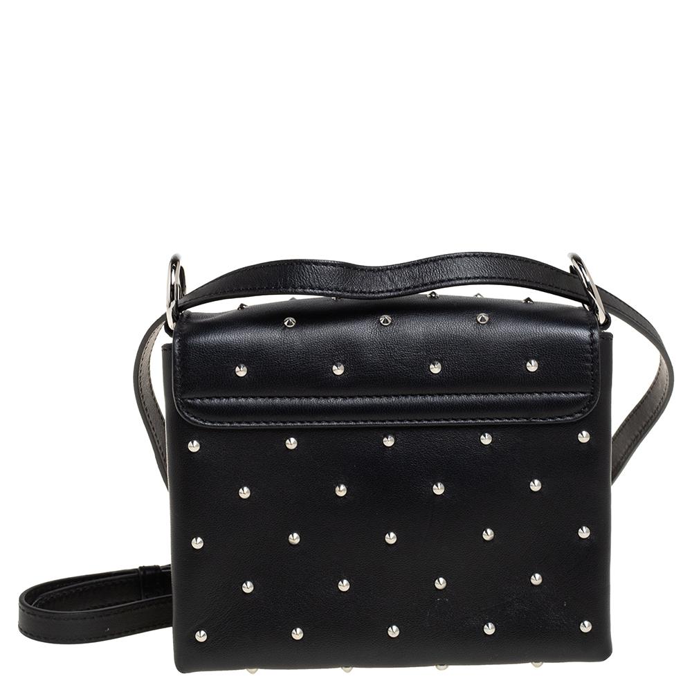 A great pick of the season is this studded leather crossbody bag by Alexander McQueen. Crafted beautifully, the bag has canvas-lined compartments to ensure that the functional charm is delivered from outside as well as inside. It is held by a