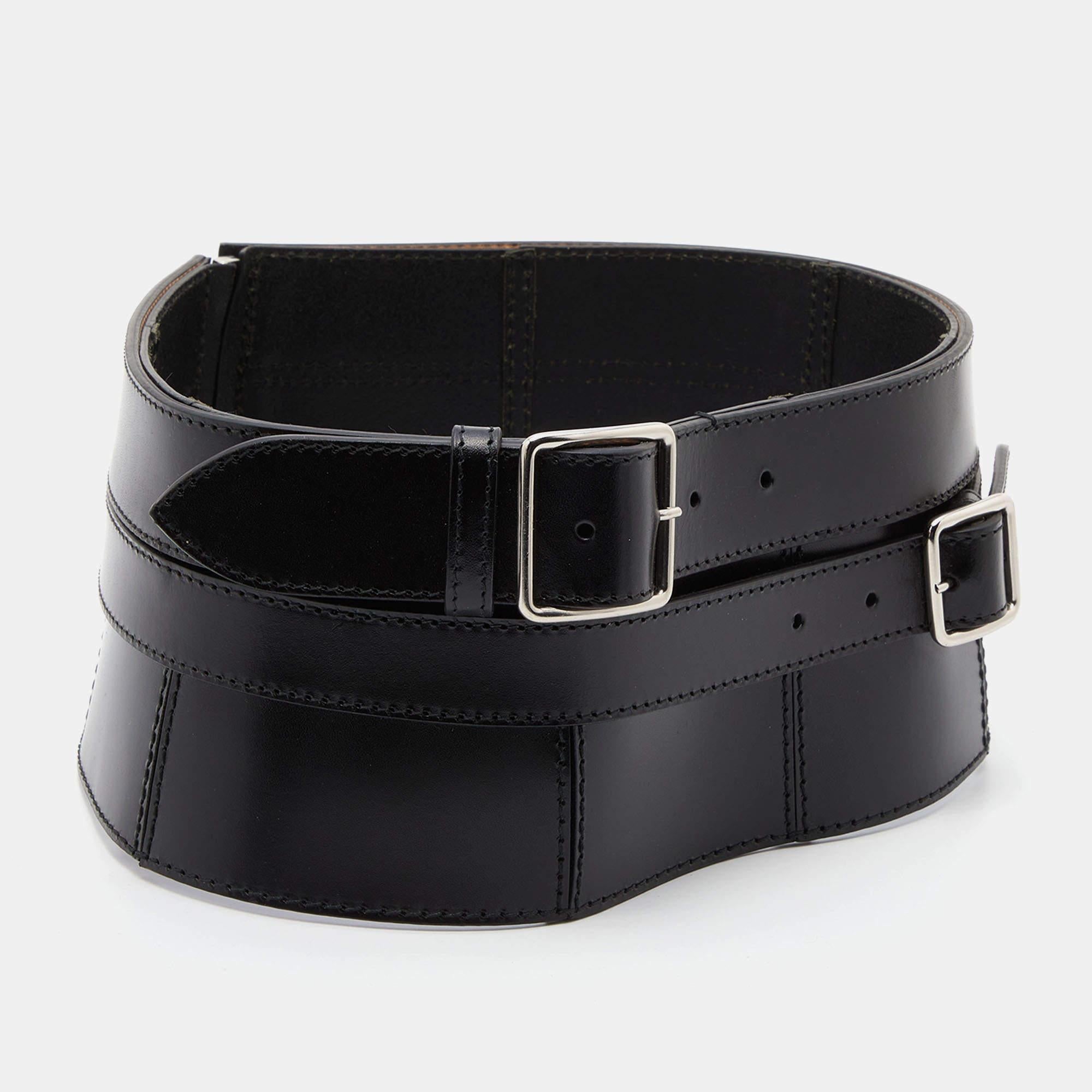 Belts are fine accessories to upgrade any basic look to a statement-making one. We particularly love this offering by Alexander McQueen. Formed using leather, the black belt has dual buckles and zip closure.

Includes: Brand Tag
